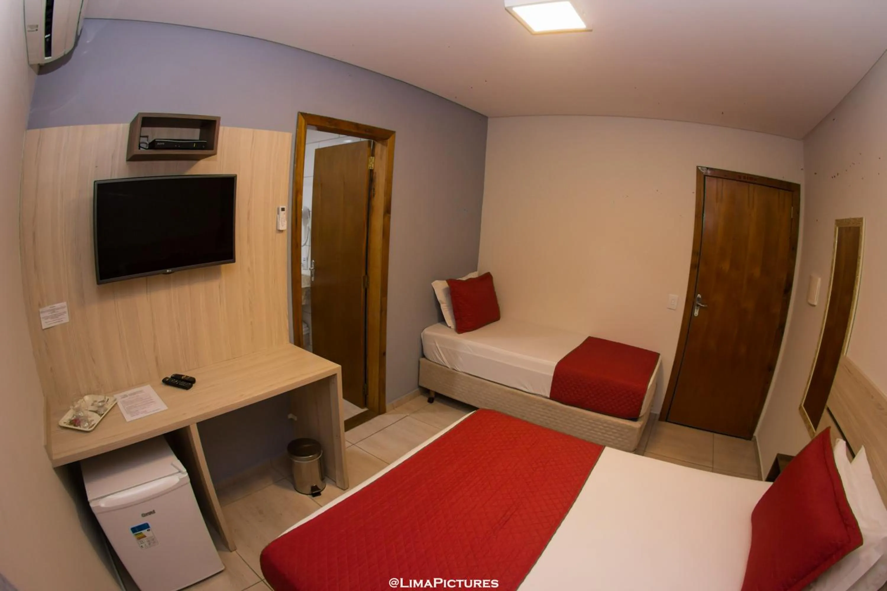 Bed in Pousada Villarejo Armação