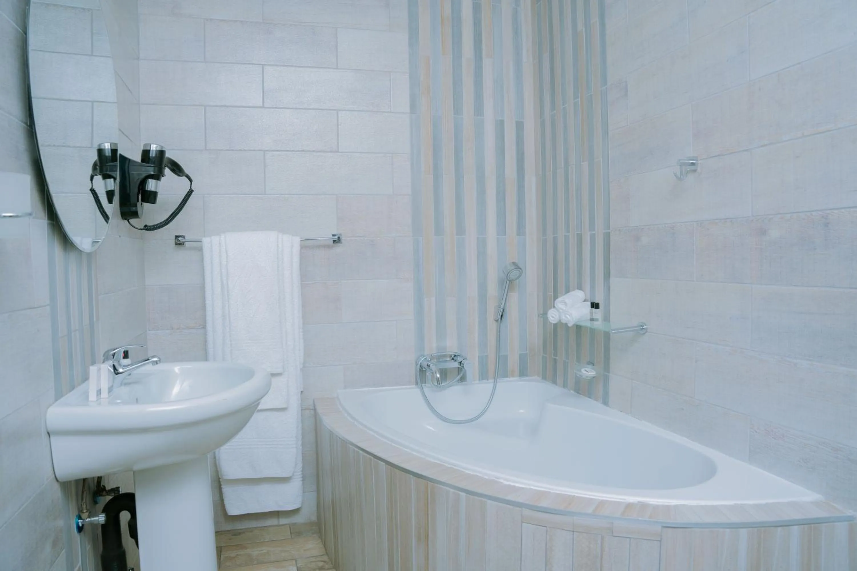 Bathroom in Q's Boutique Stay