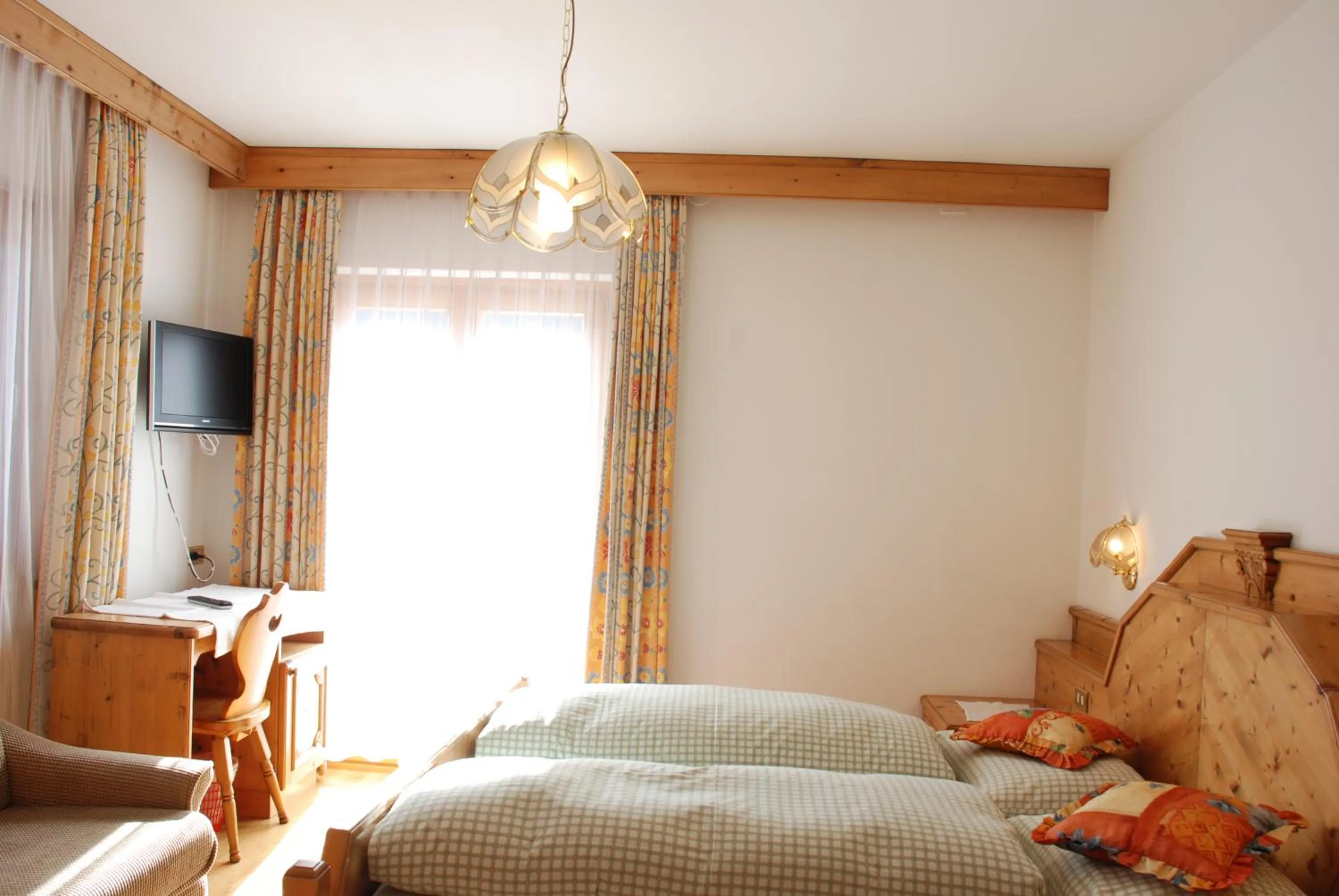 Photo of the whole room, Bed in Garni Cristallo