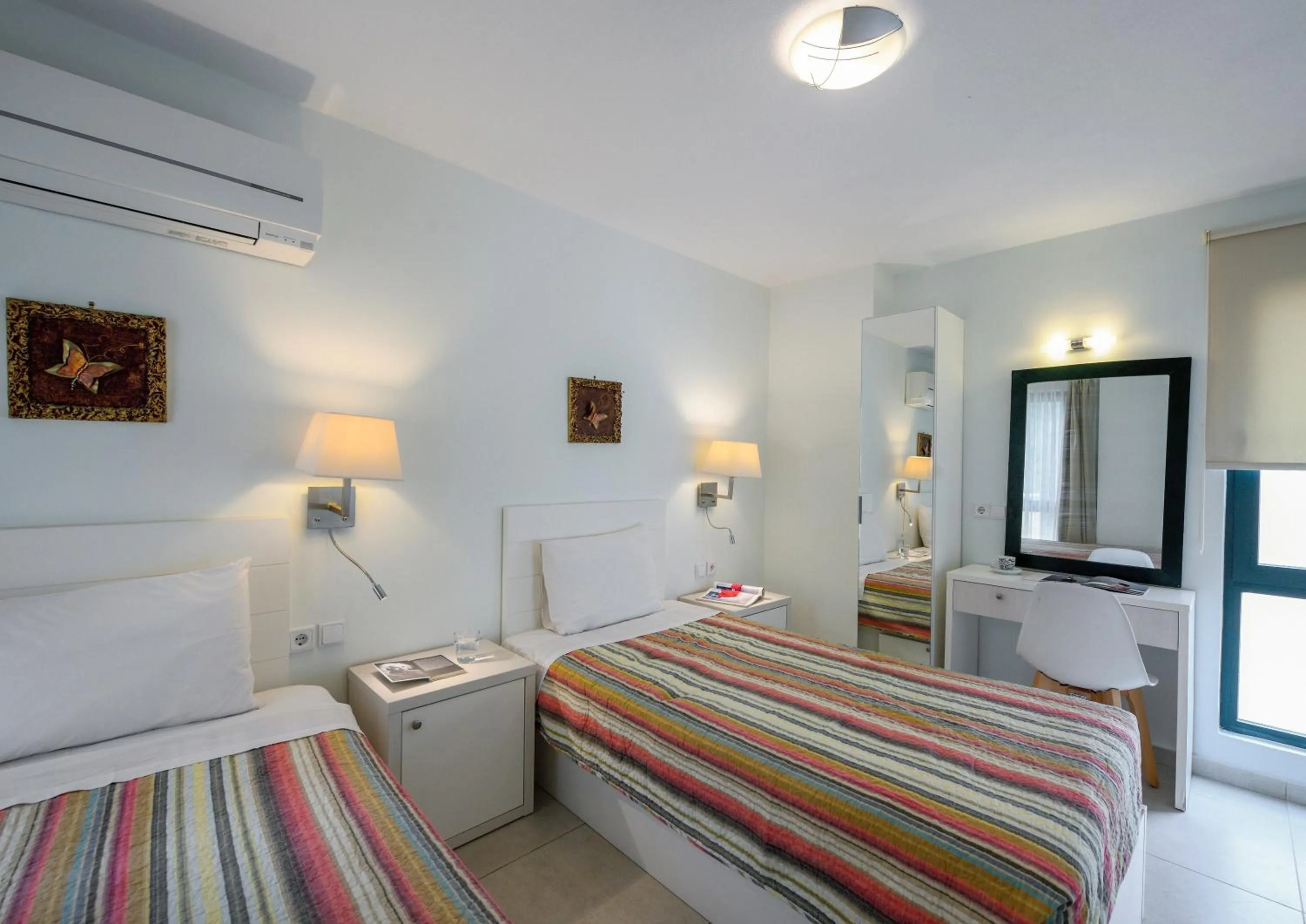 Bed in Elpiniki Luxury Apartments