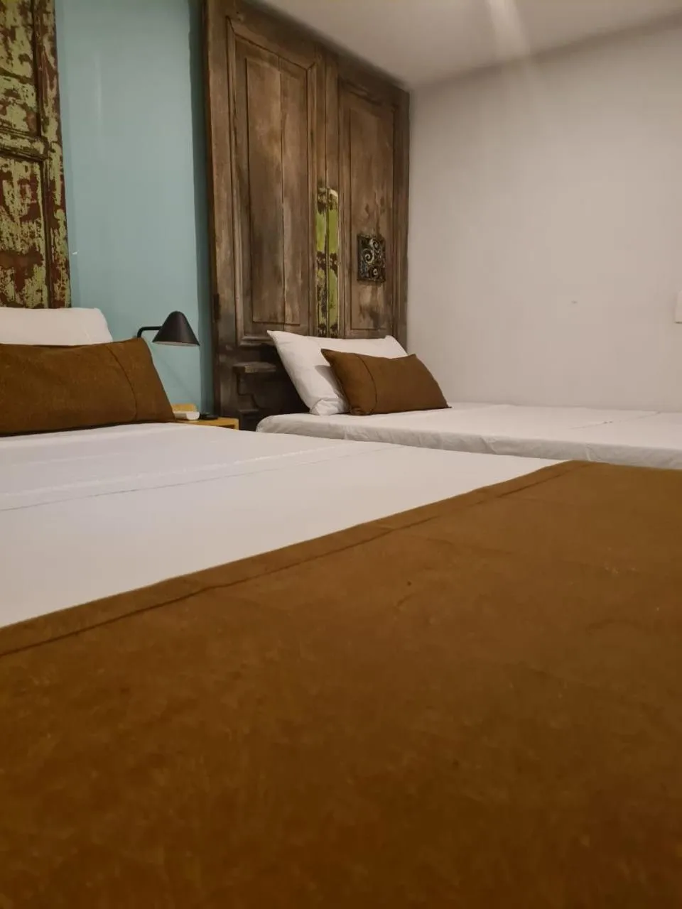 Bed in Rivière Boutique Hotel