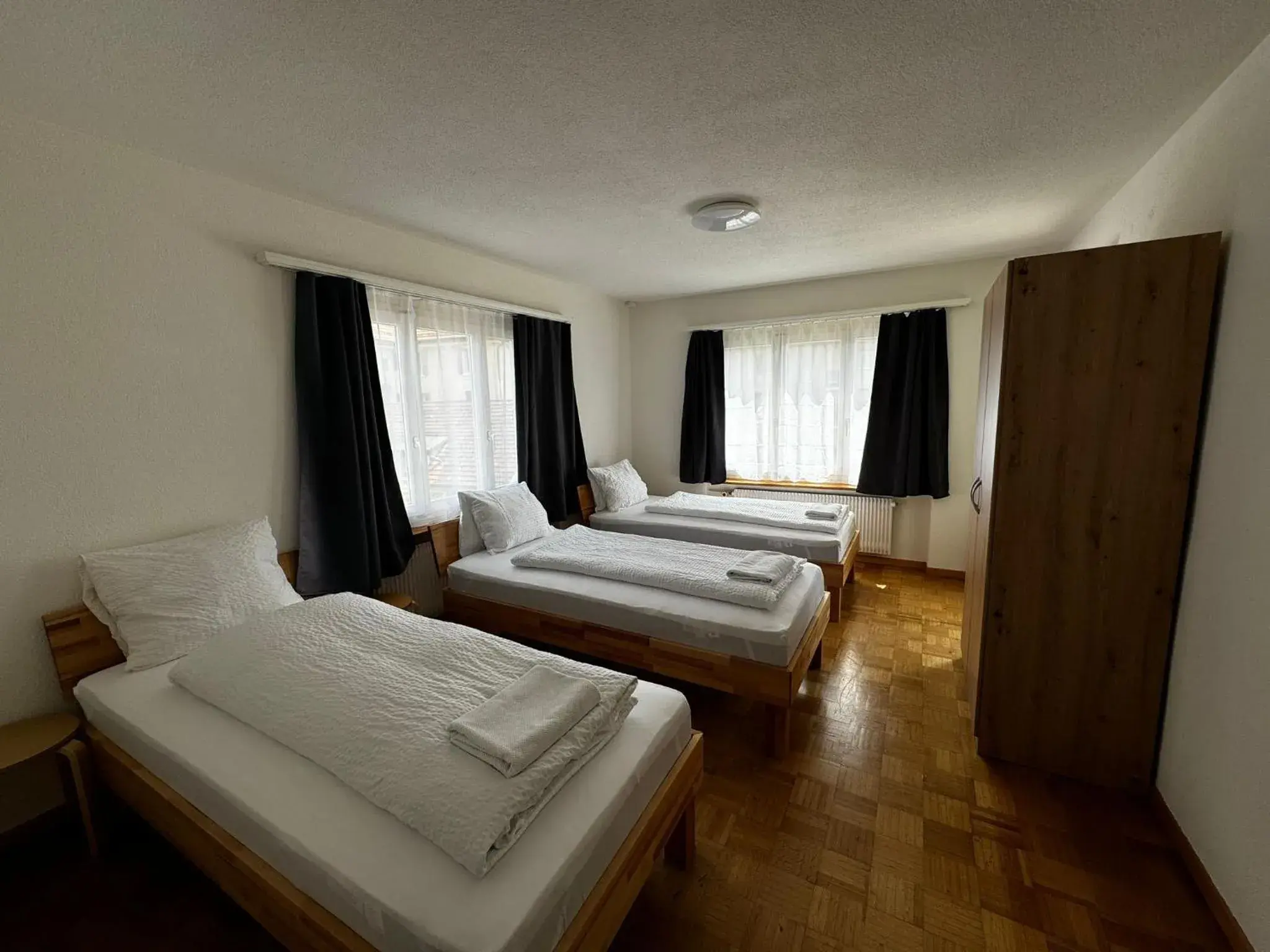 Triple Room with Shared Bathroom in Swiss Holidays-City Apartments Interlaken Triple Room with Shared Bathroom in Swiss Holidays-City Apartments Interlaken