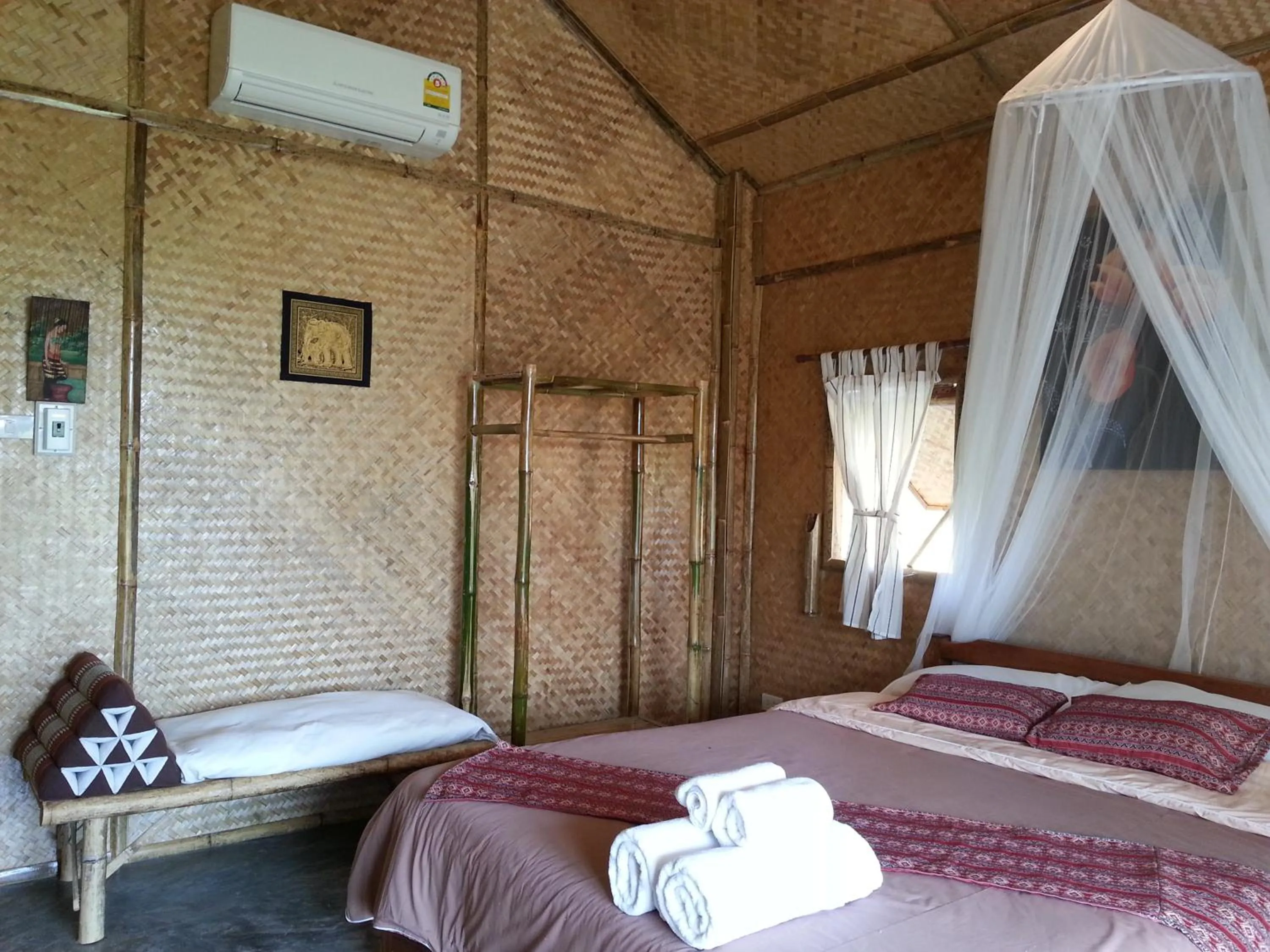 Bed in Tulip Resort Pai