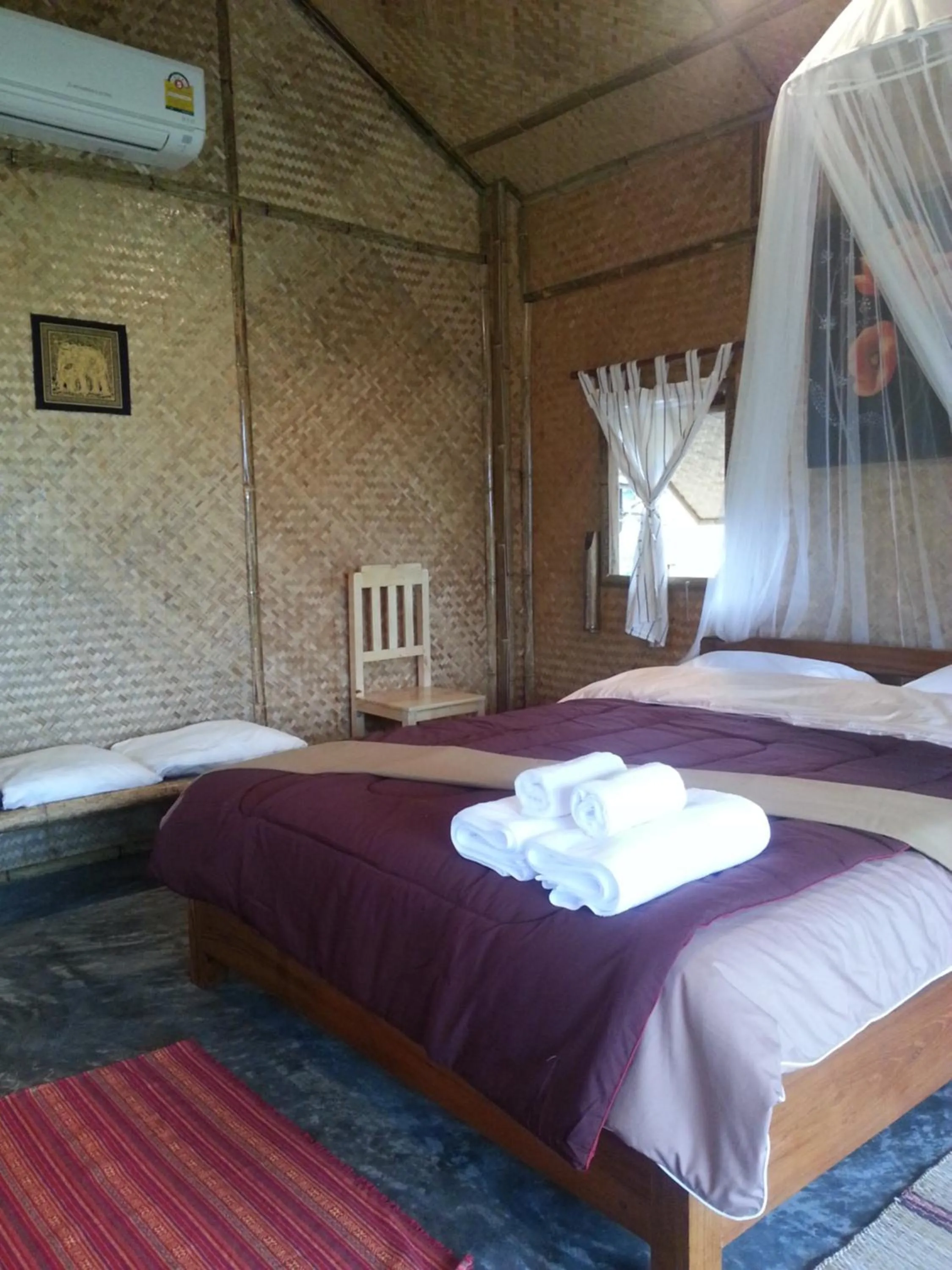 Bed in Tulip Resort Pai