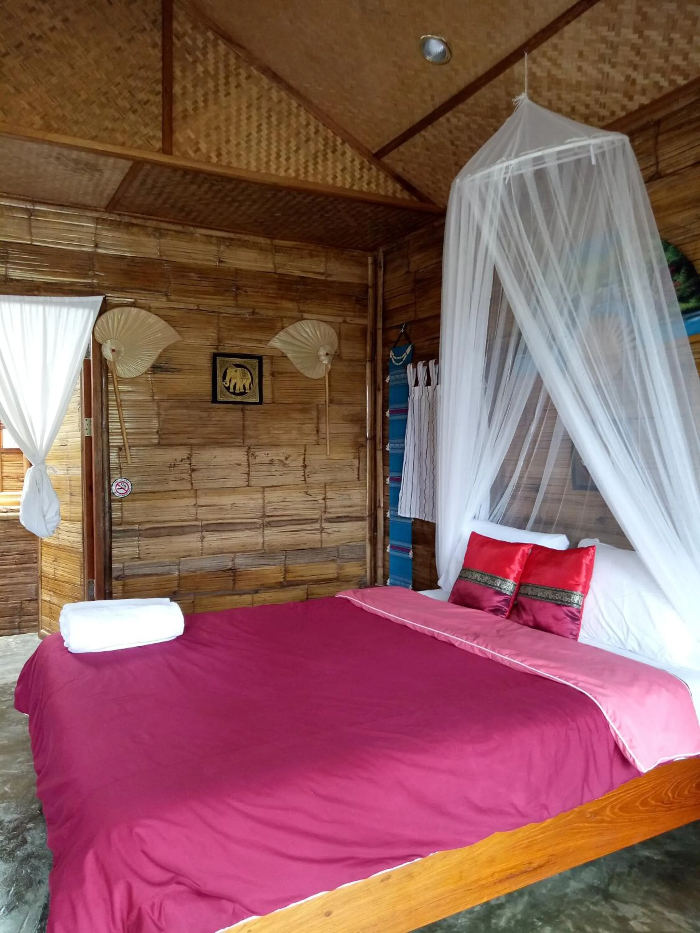 Bed in Tulip Resort Pai