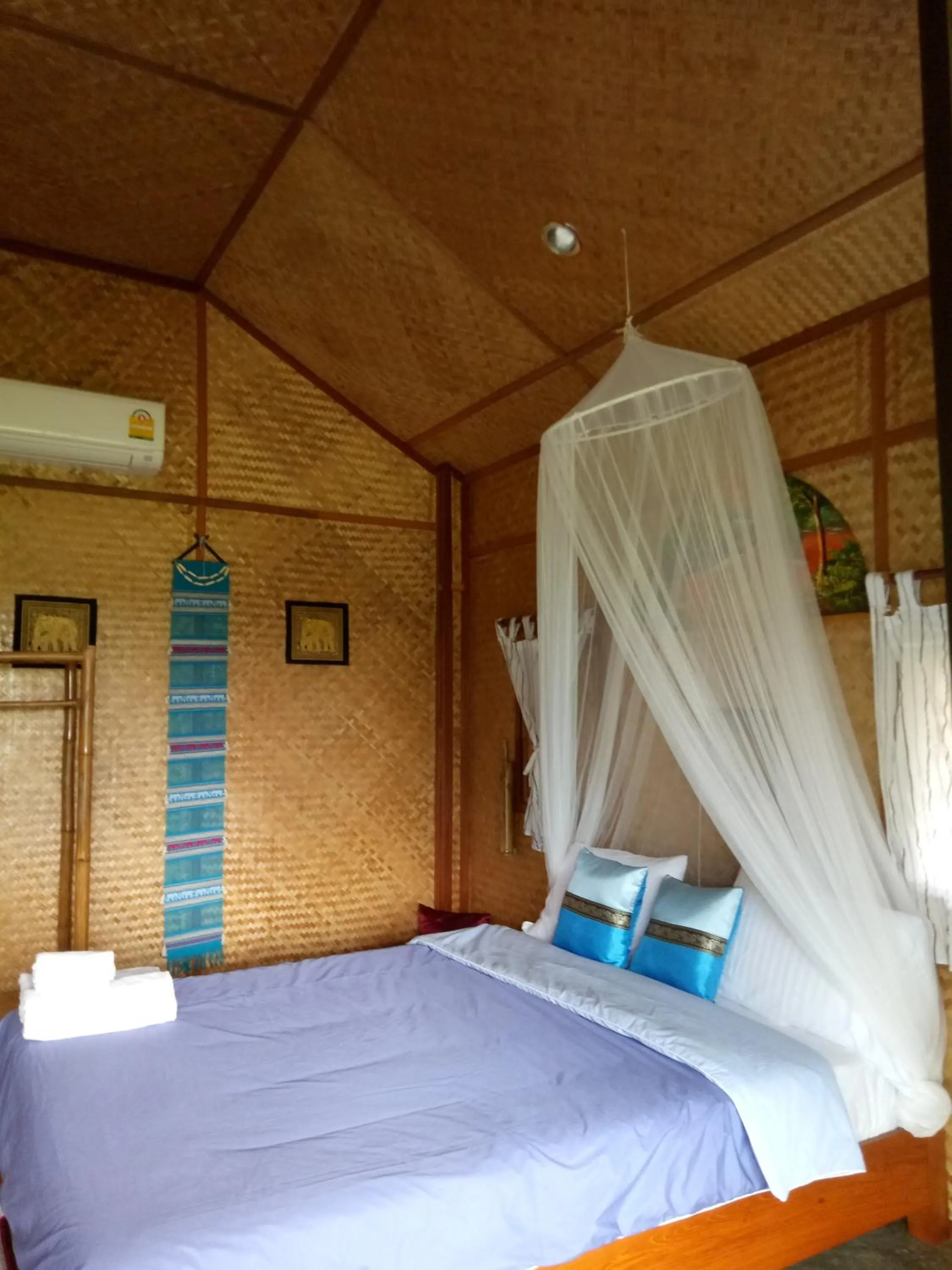 Bed in Tulip Resort Pai