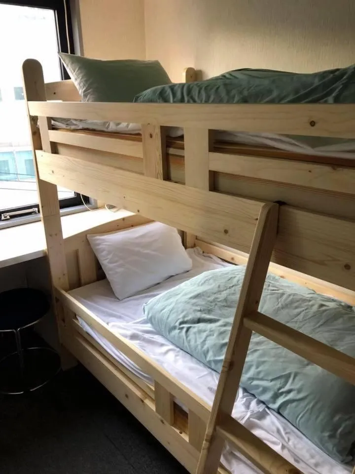 Bed in Guest House M104 Kagoshima