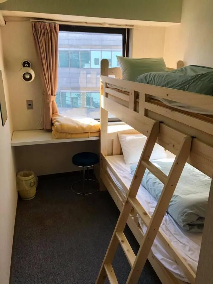 Bed in Guest House M104 Kagoshima