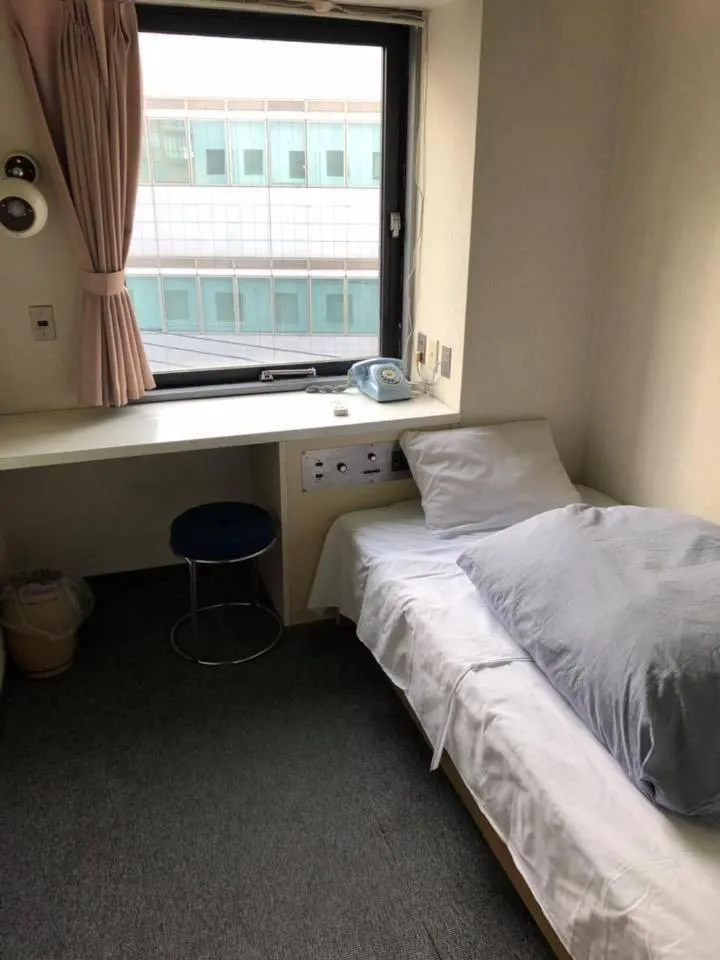 Bed in Guest House M104 Kagoshima