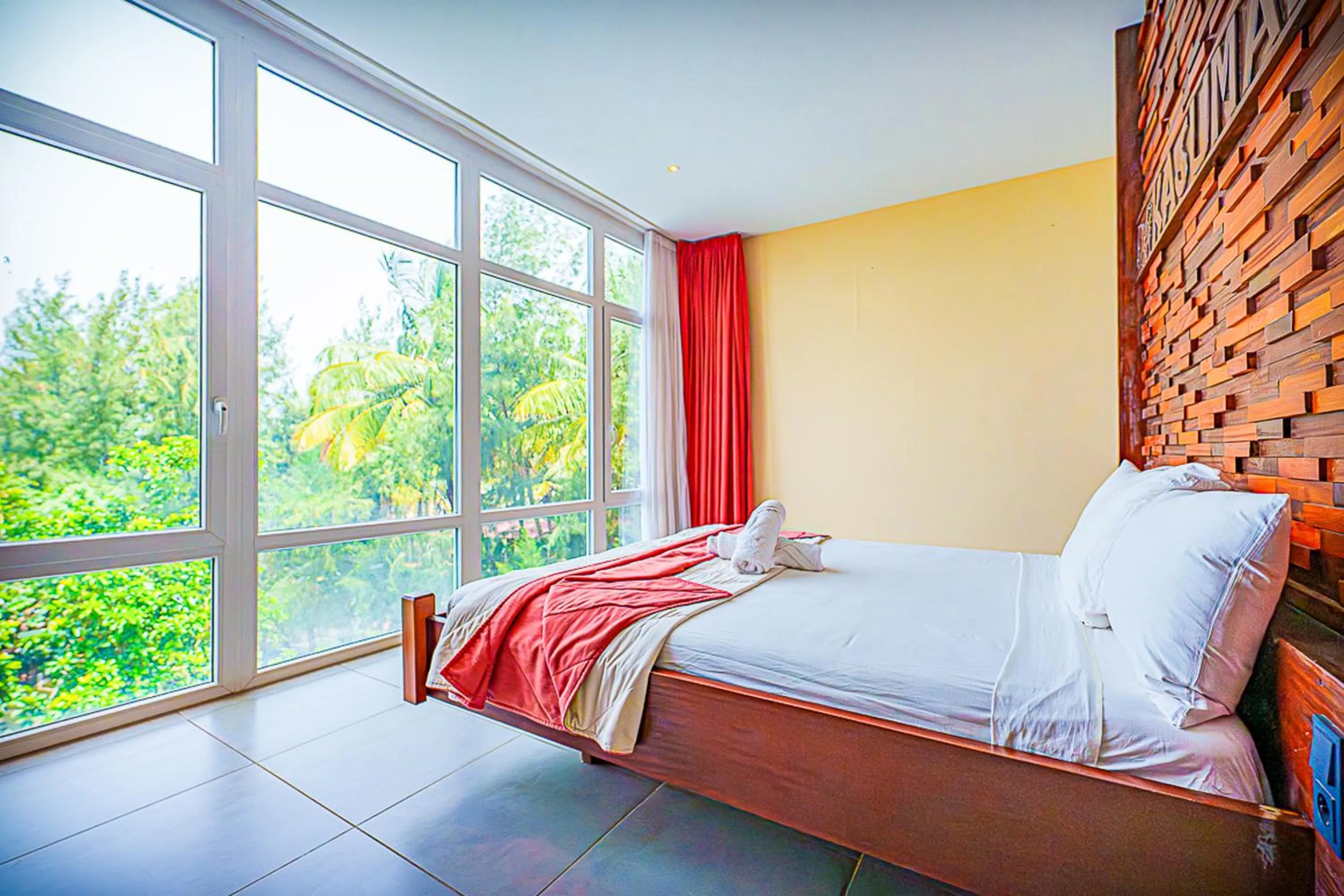 Bed in Kasumai Beach Resort