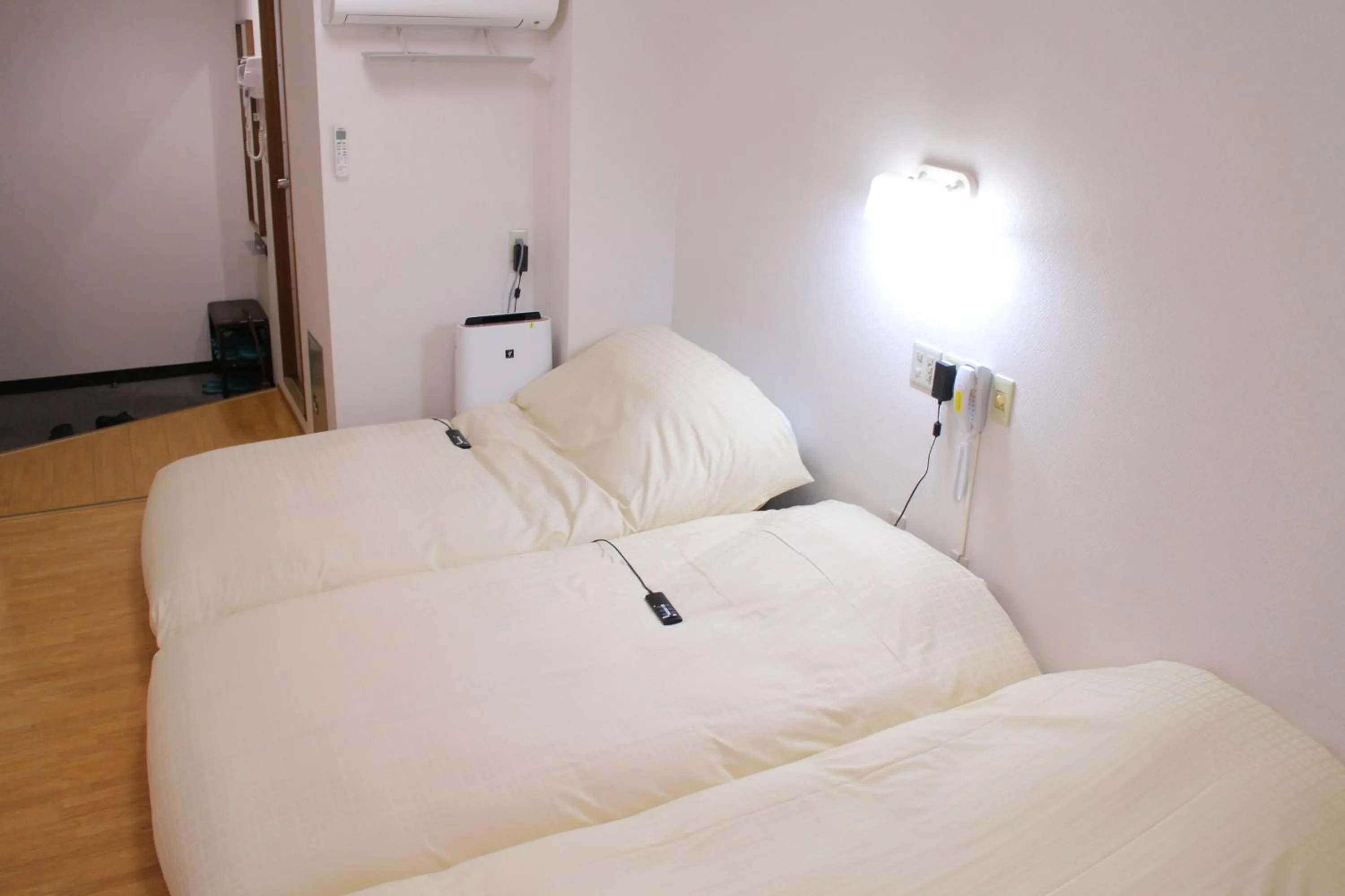 Bed in Business Hotel Raicho