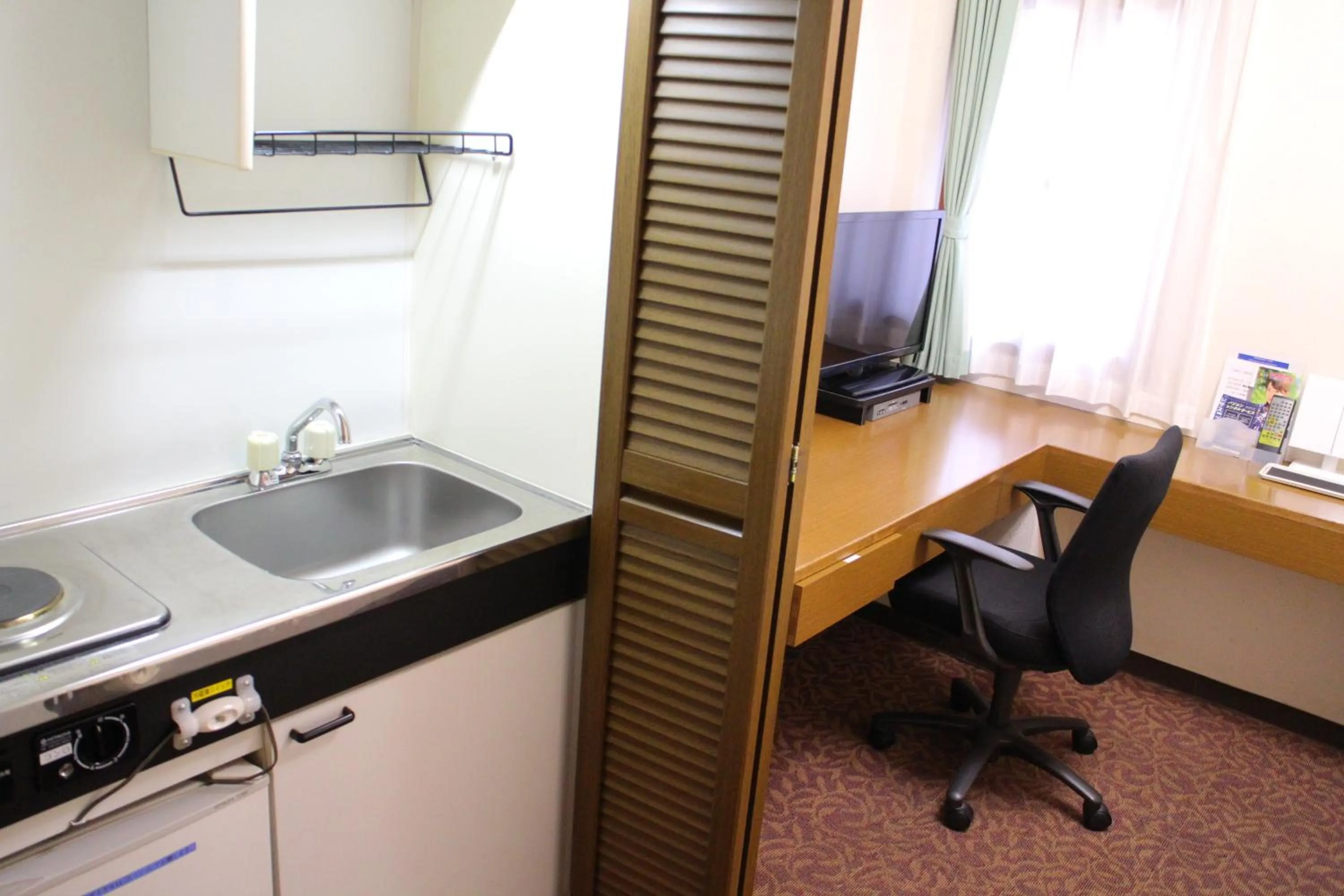 Kitchen or kitchenette in Business Hotel Raicho