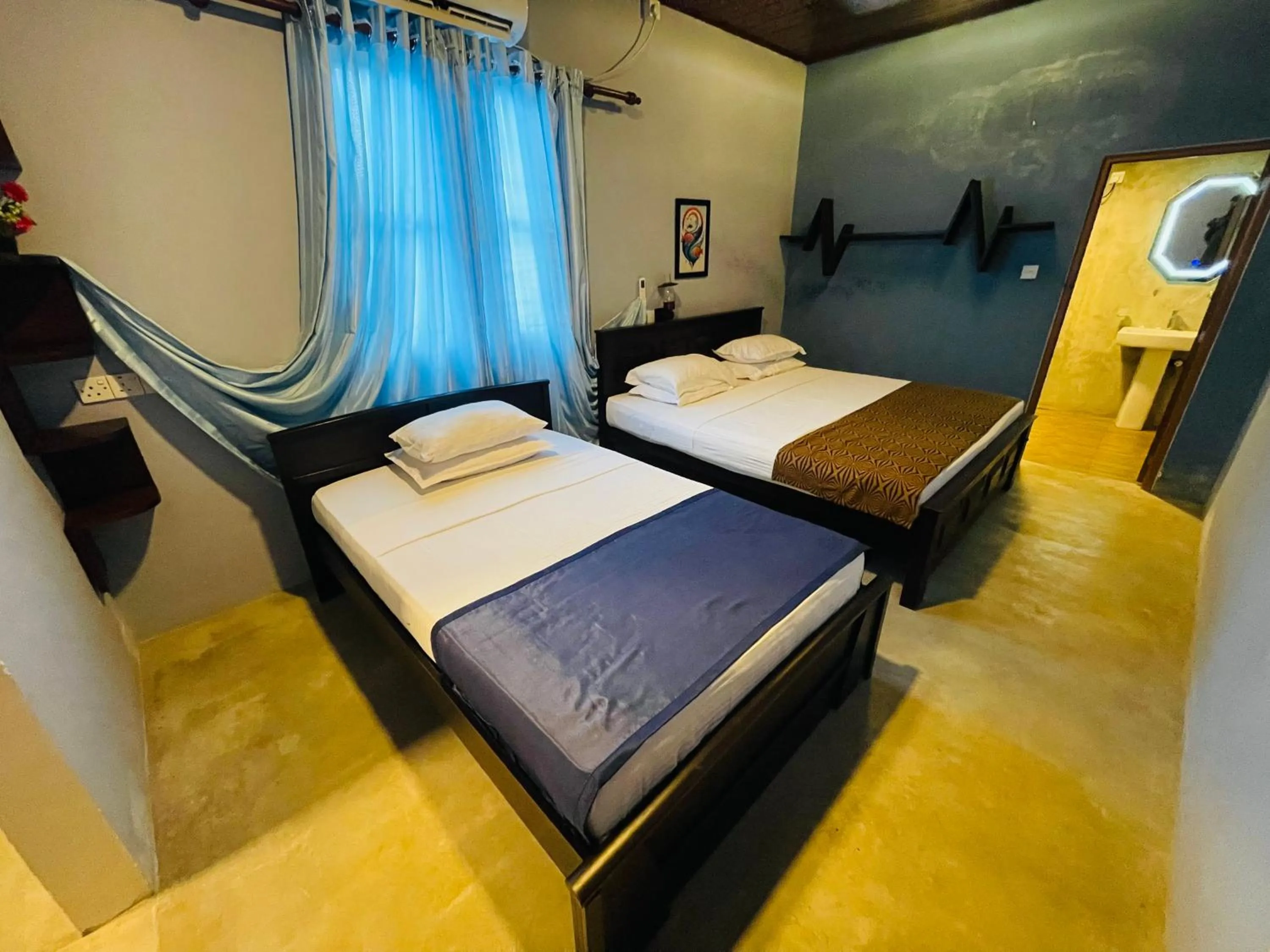 Bed in Nilaveli Hybrid Holiday Hotel