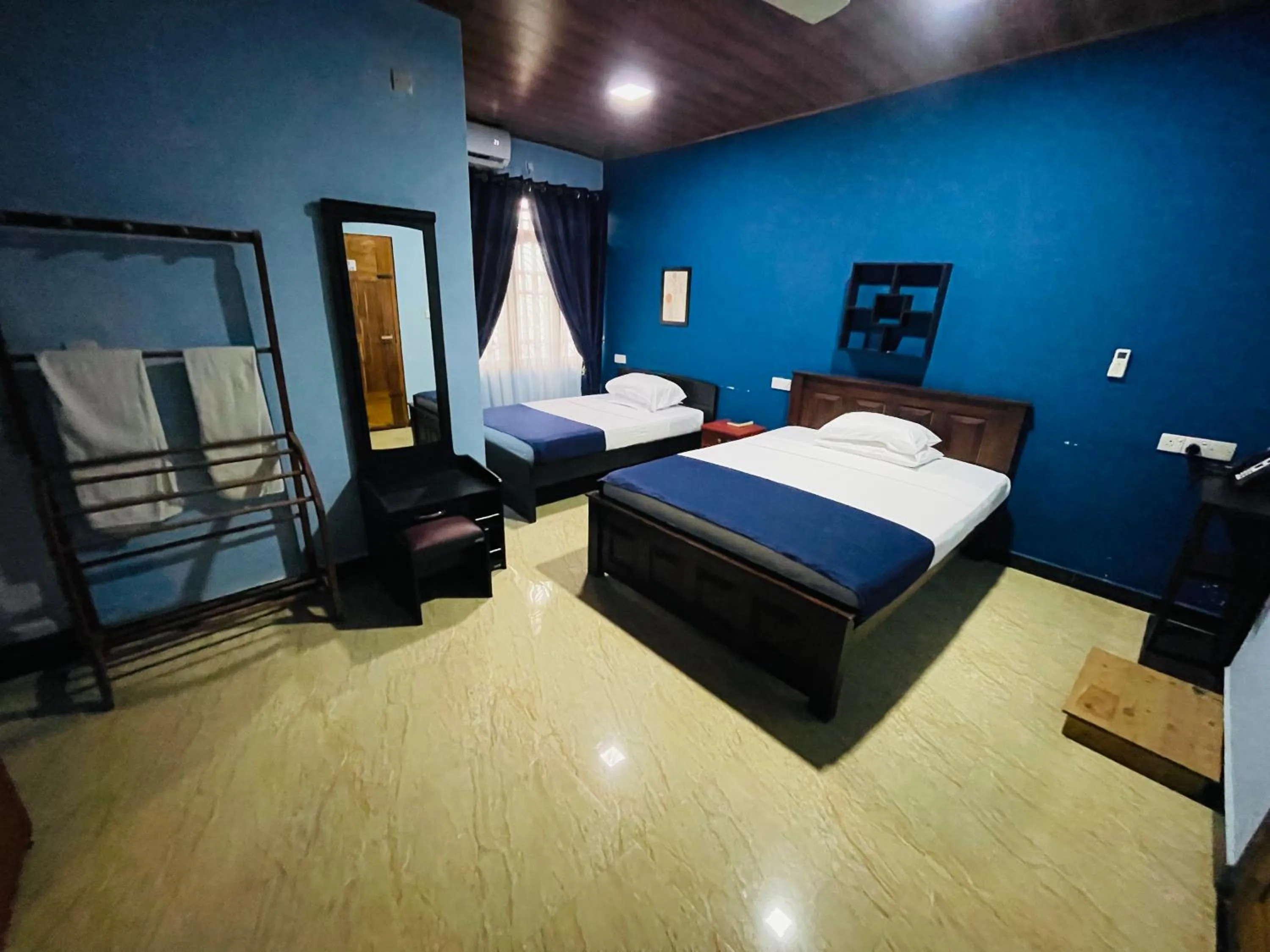 Bed in Nilaveli Hybrid Holiday Hotel
