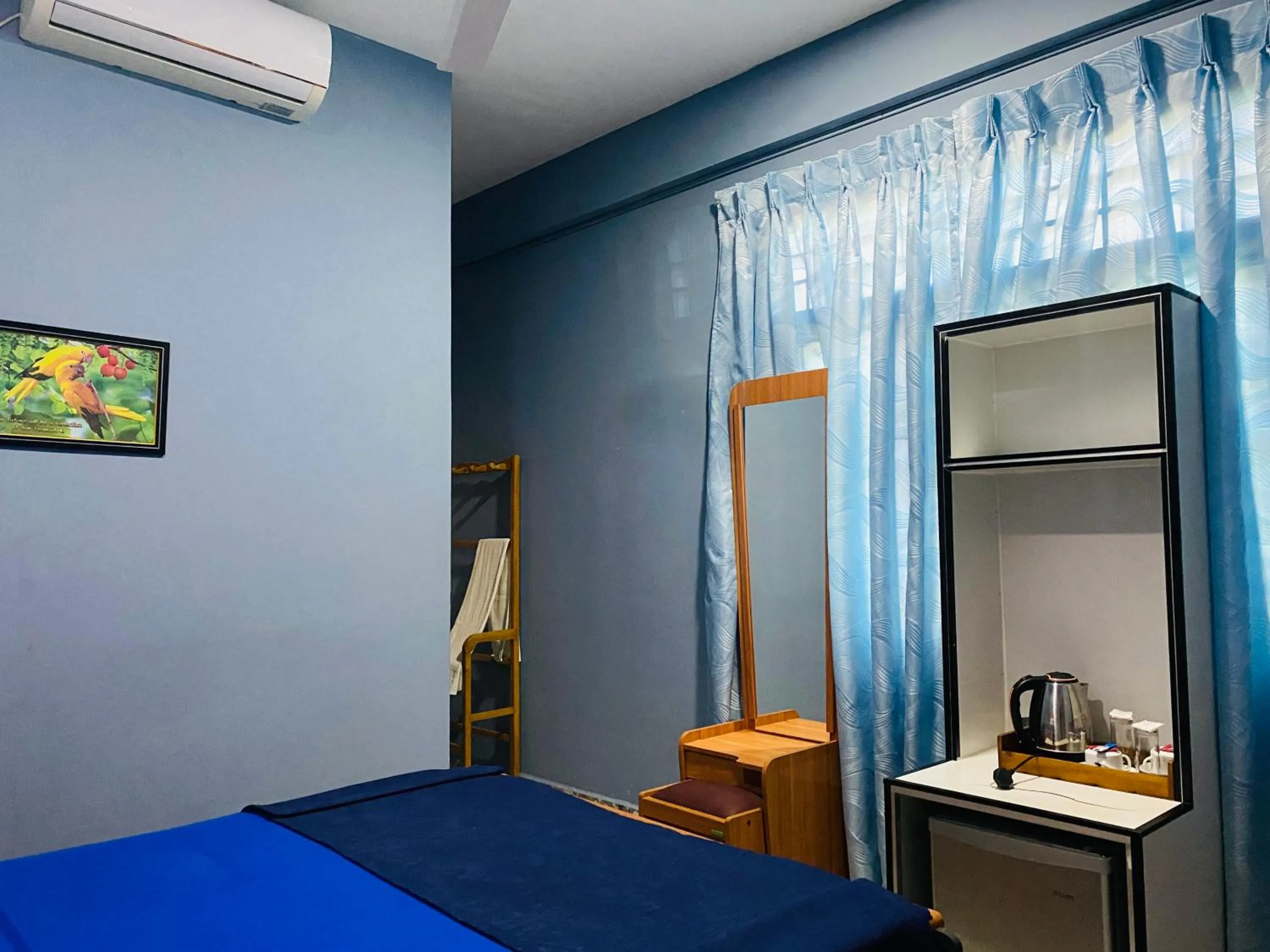 Bed in Nilaveli Hybrid Holiday Hotel