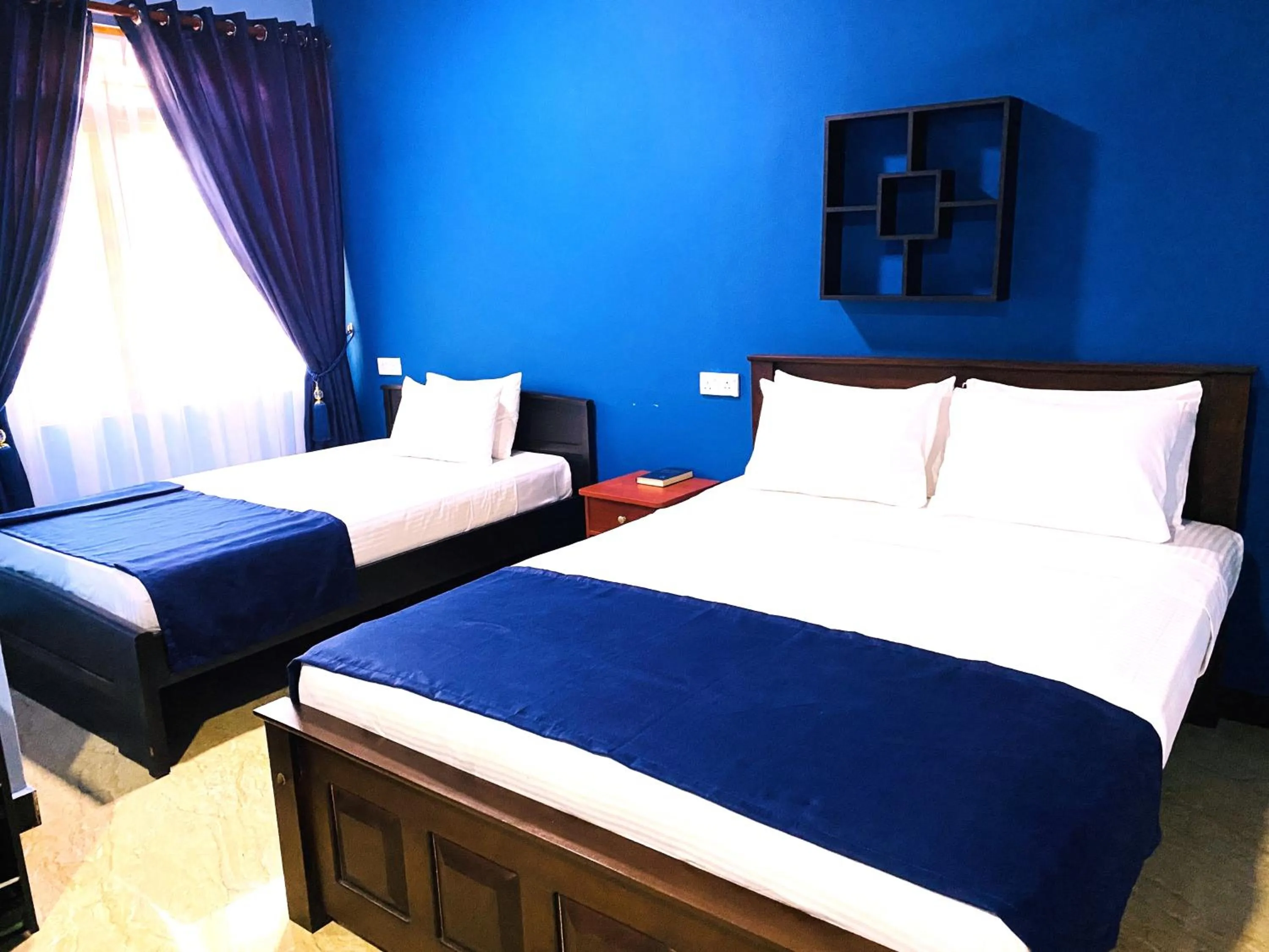 Bed in Nilaveli Hybrid Holiday Hotel
