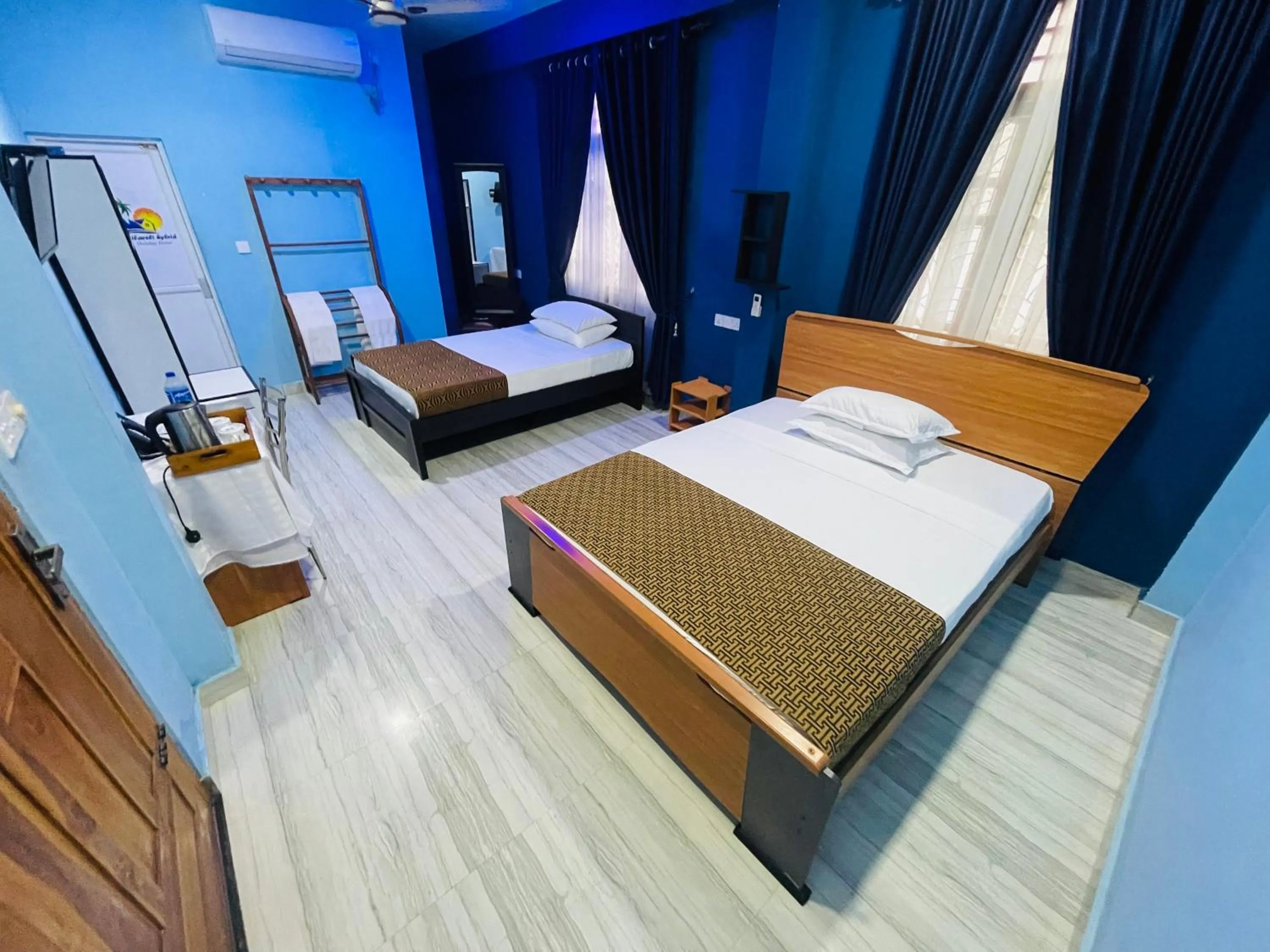 Bed in Nilaveli Hybrid Holiday Hotel