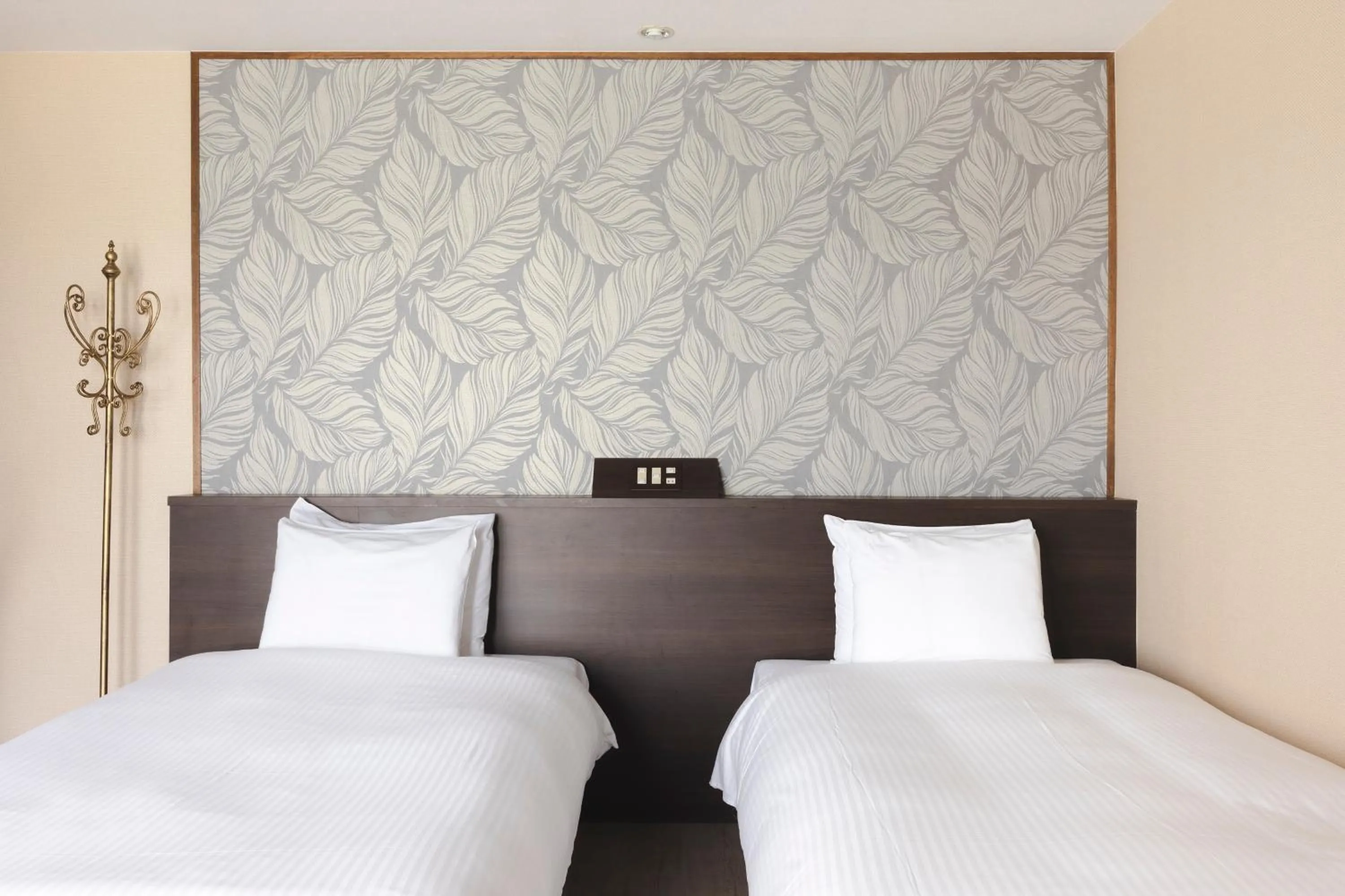 Bed in La Casa Panacea Okinawa Resort