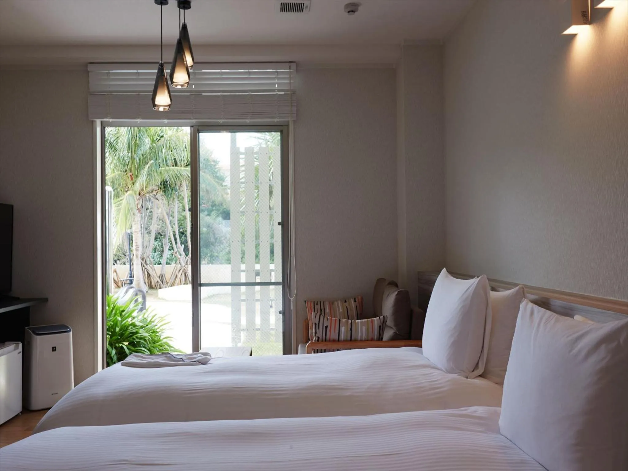 Bed in La Casa Panacea Okinawa Resort