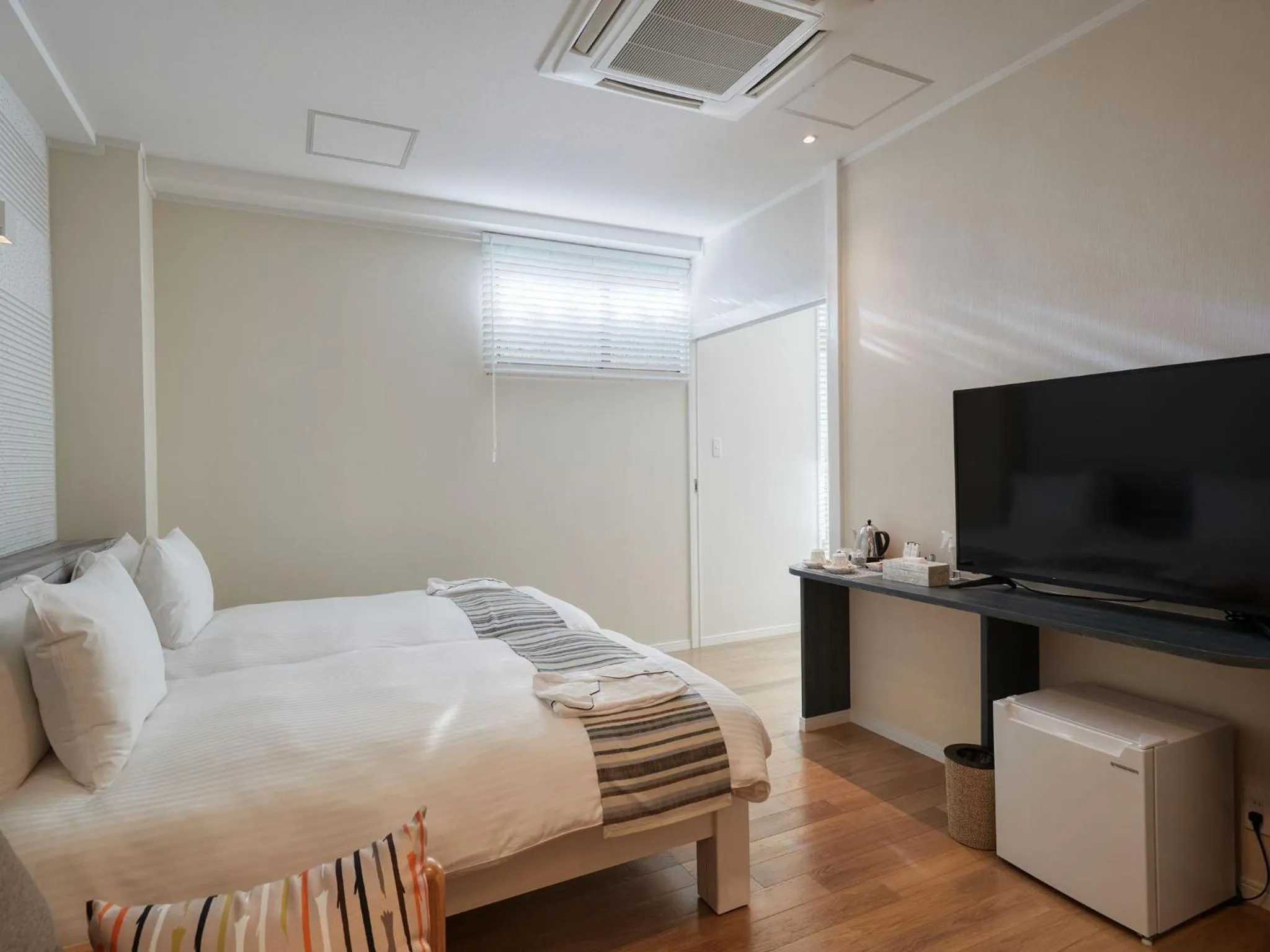 Photo of the whole room, Bed in La Casa Panacea Okinawa Resort