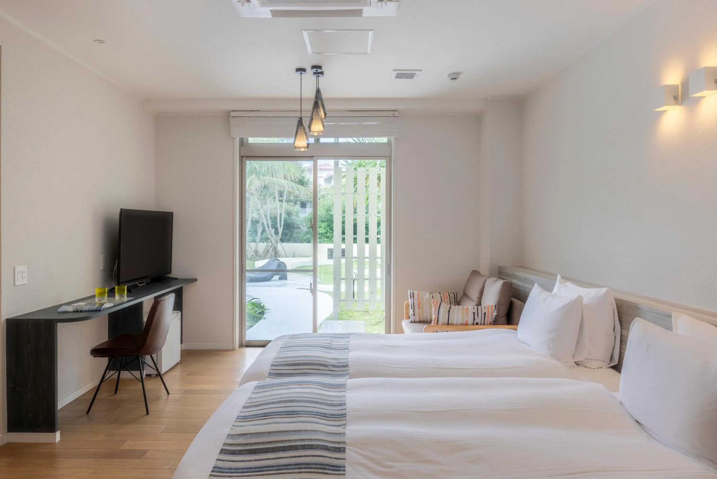 Photo of the whole room, Bed in La Casa Panacea Okinawa Resort