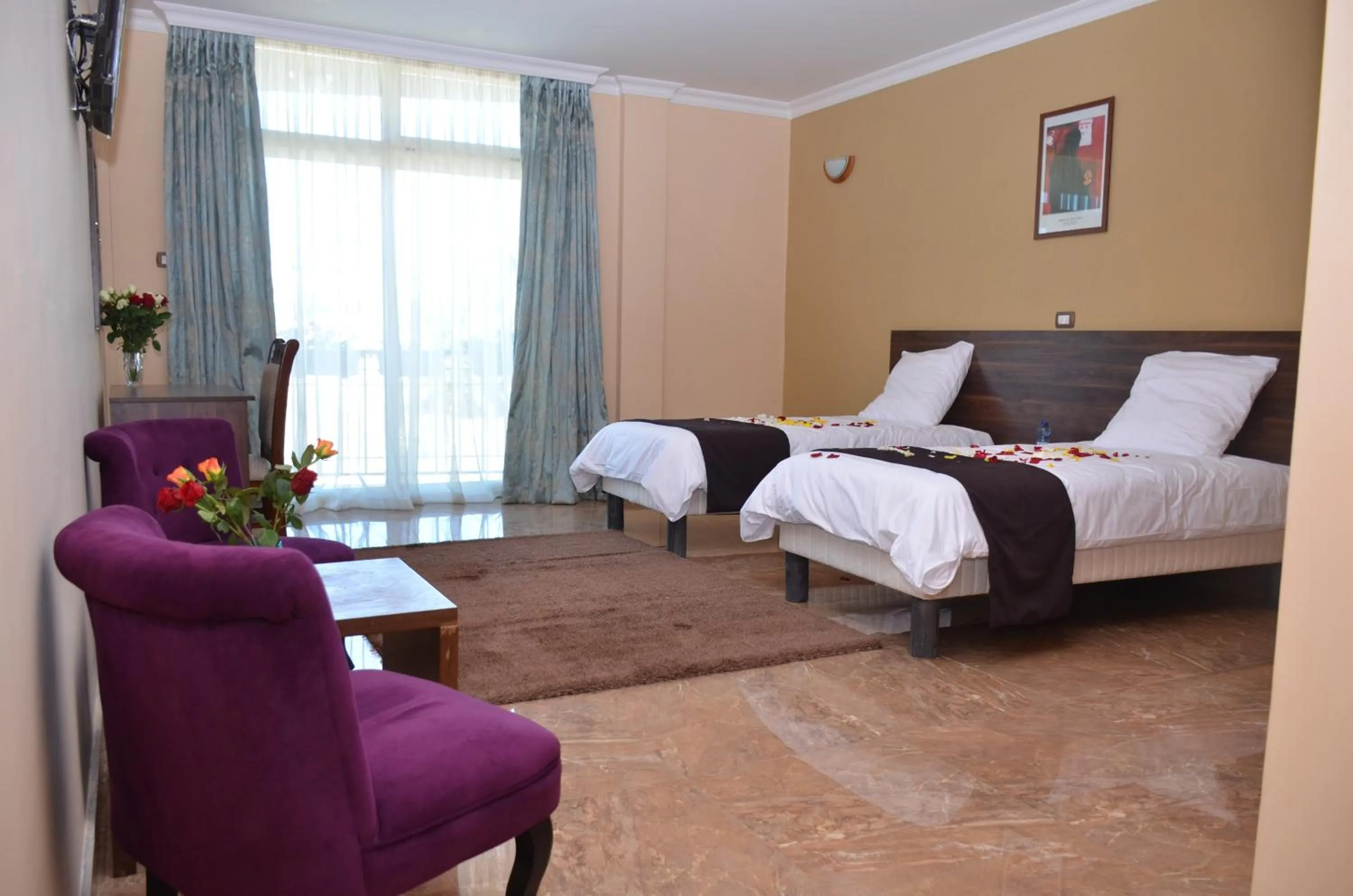 Seating area, Bed in Melodie Hotel