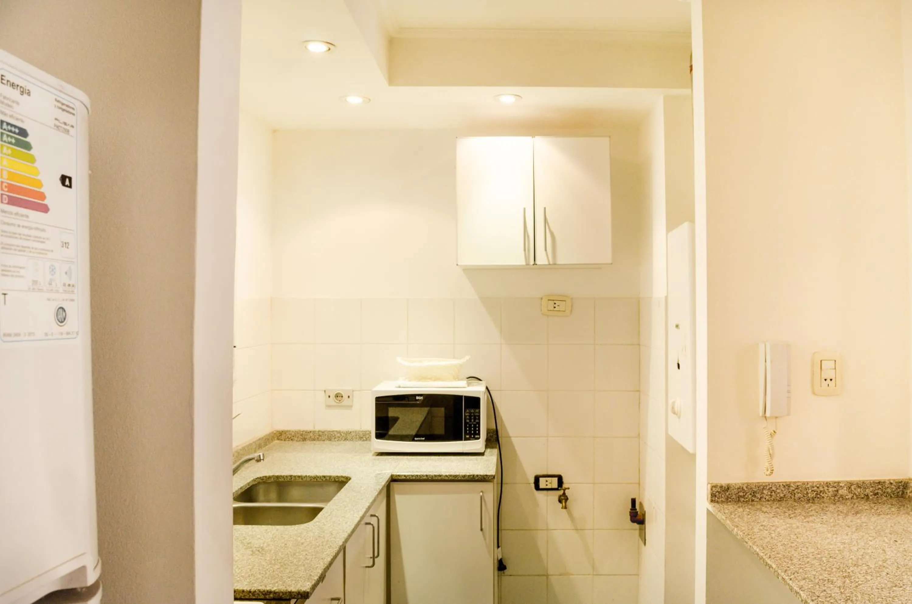 Kitchen or kitchenette in Lofty Departamentos Temporarios