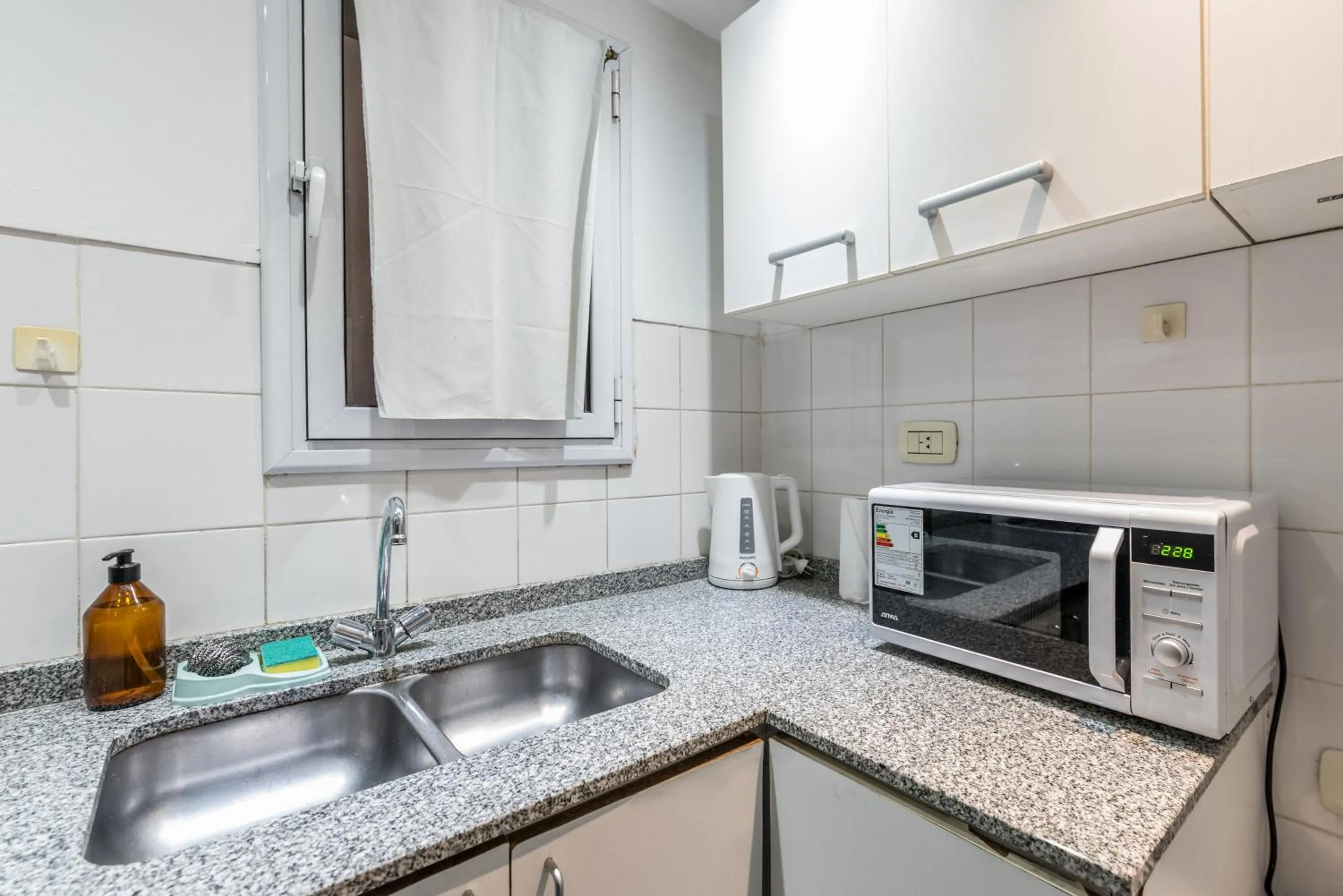 Kitchen or kitchenette in Lofty Departamentos Temporarios