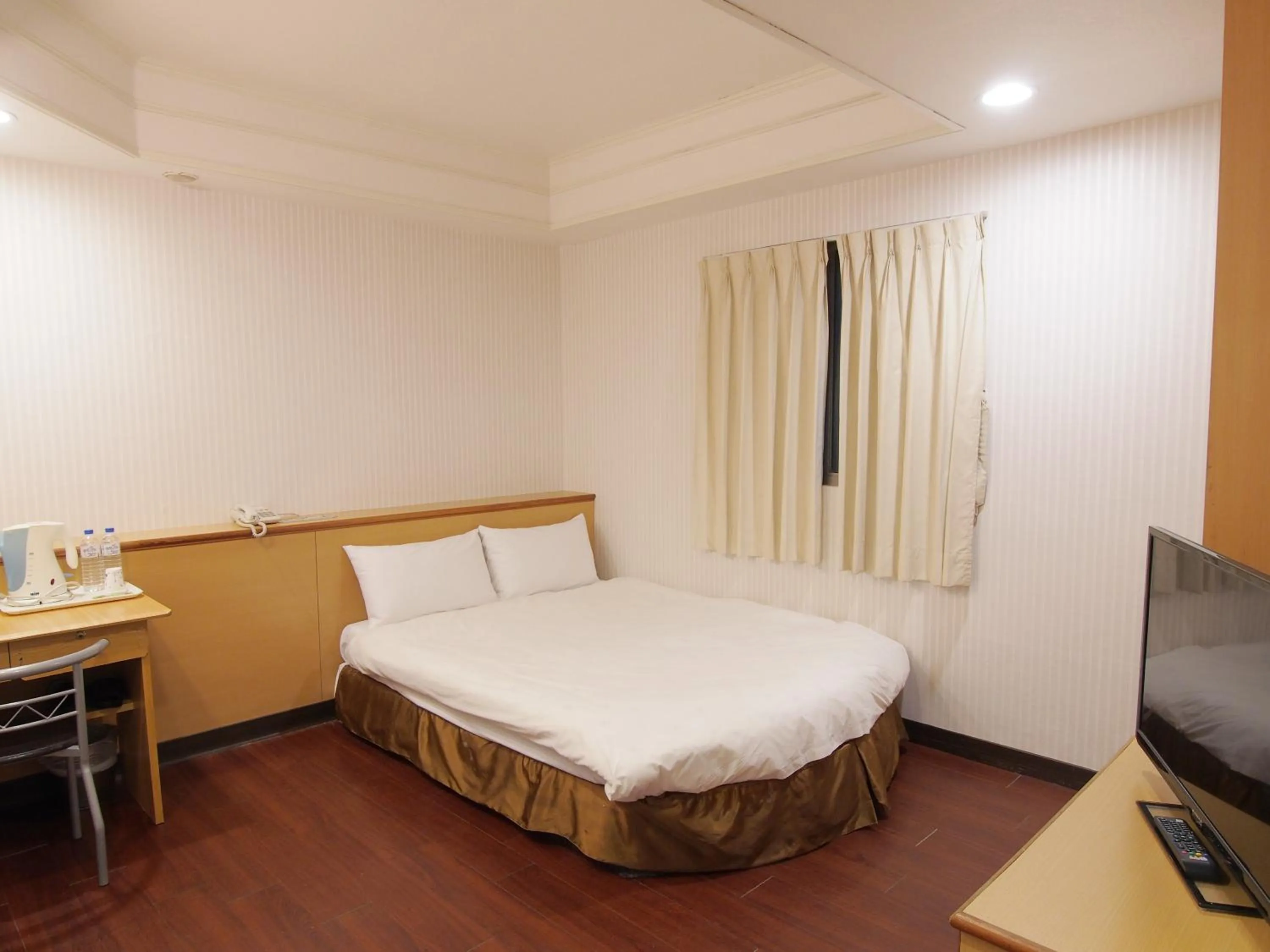 Bed in Yi Pin Yuan Hotel