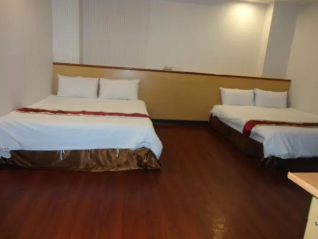 Bed in Yi Pin Yuan Hotel