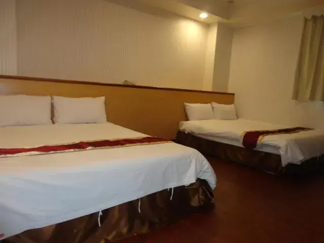 Bed in Yi Pin Yuan Hotel Bed in Yi Pin Yuan Hotel