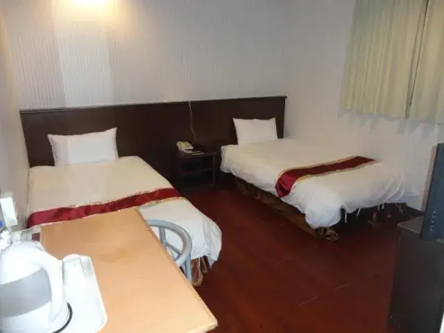 Bed in Yi Pin Yuan Hotel Bed in Yi Pin Yuan Hotel