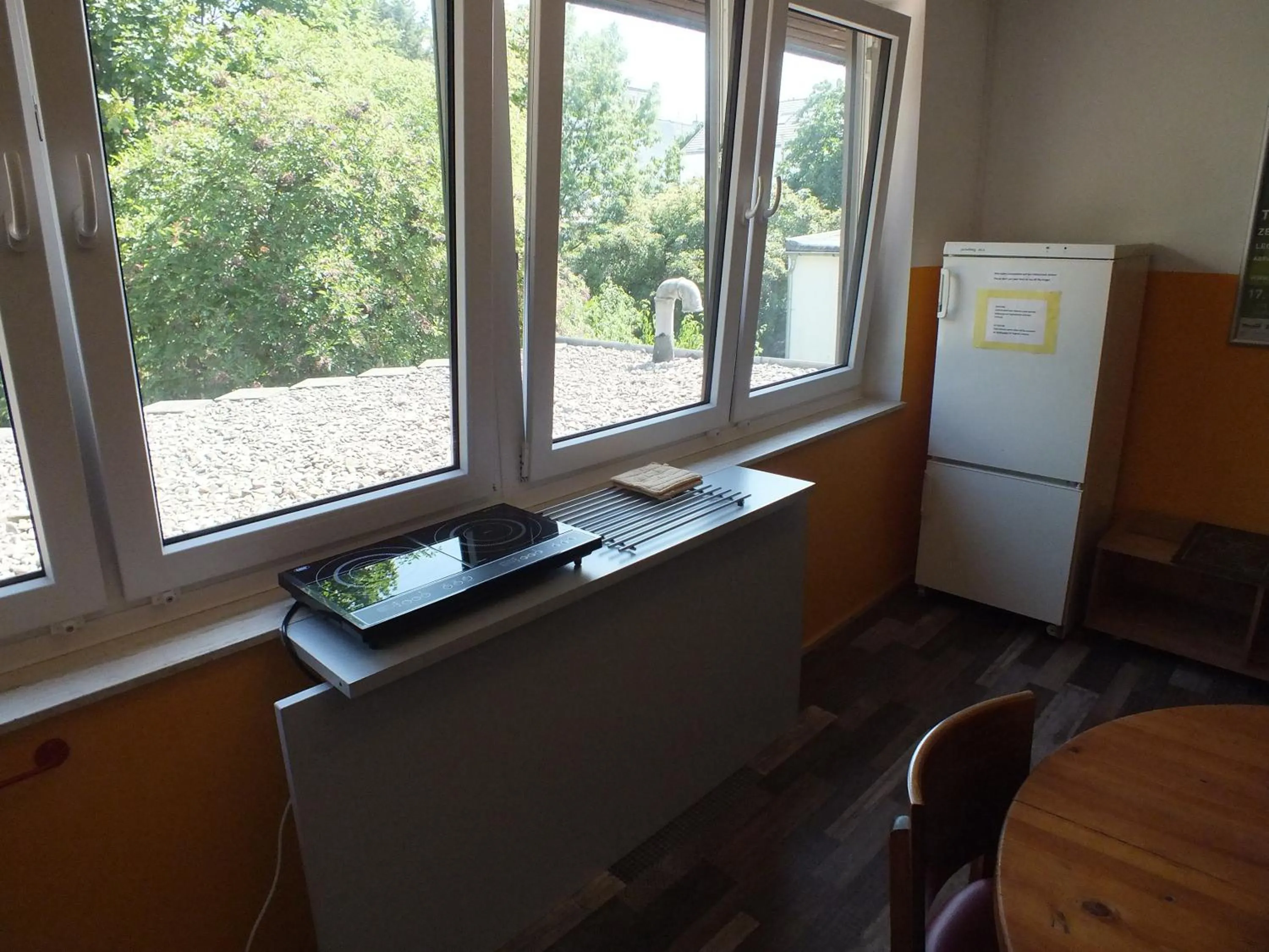 Communal lounge/ TV room in Max Hostel