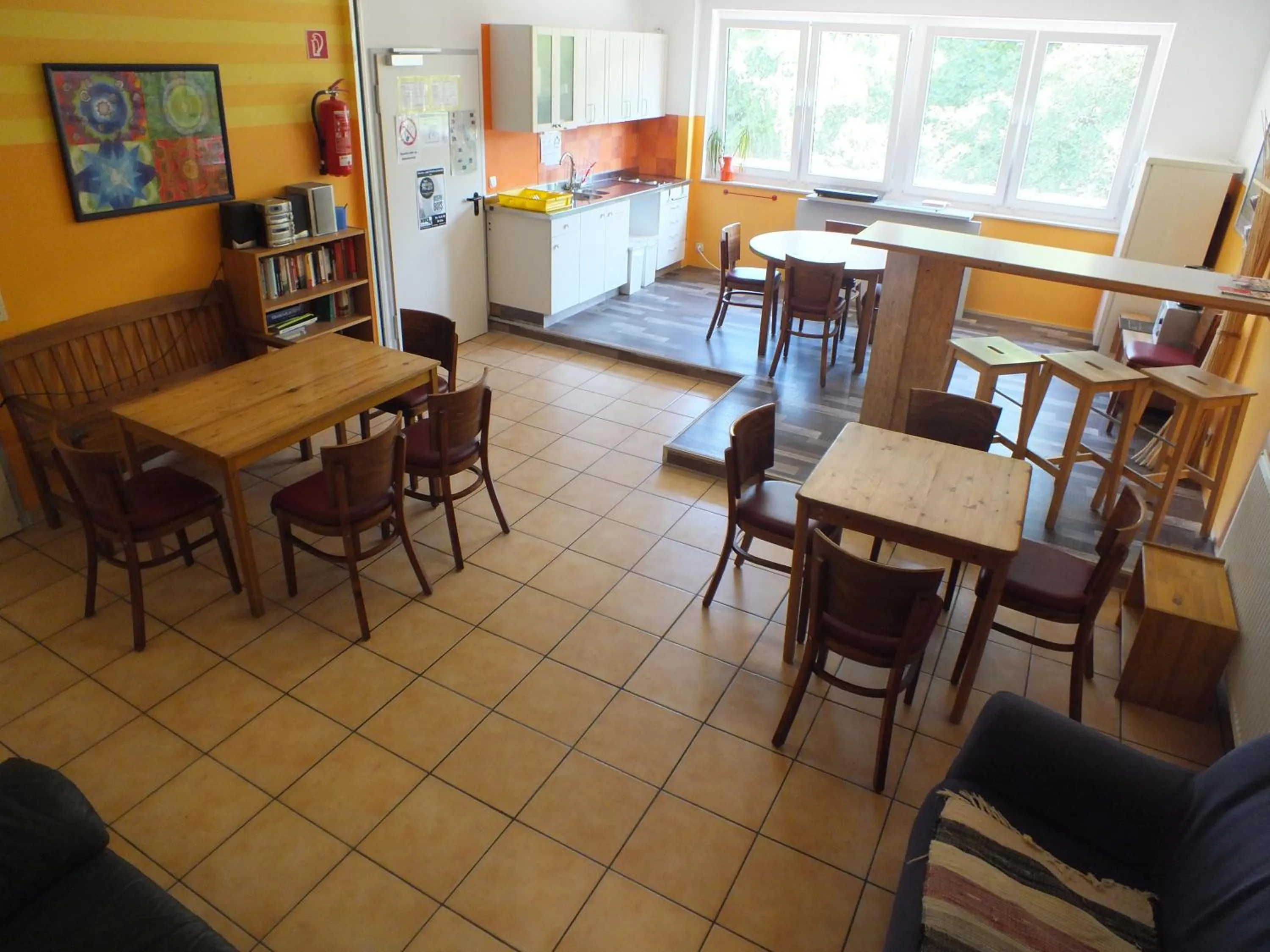 Communal lounge/ TV room in Max Hostel