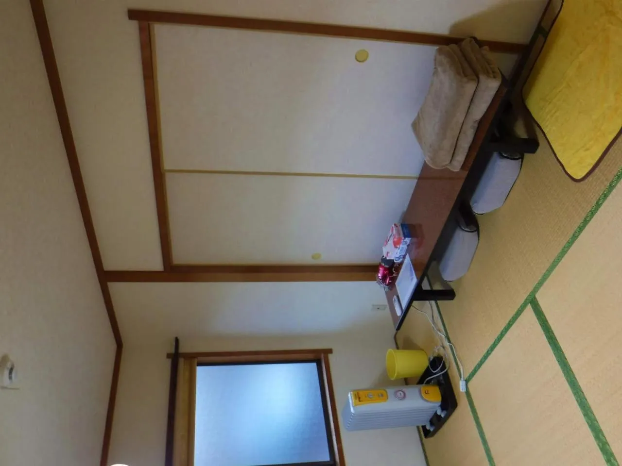 Bed in Wholeearth Ryokan Hiroshima