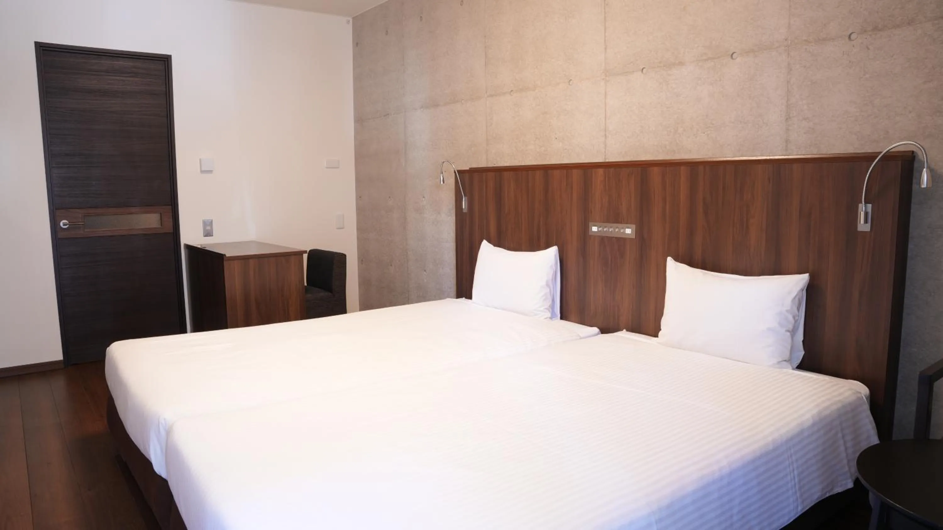 Bed in The BREAKFAST HOTEL PORTO Ishigakijima