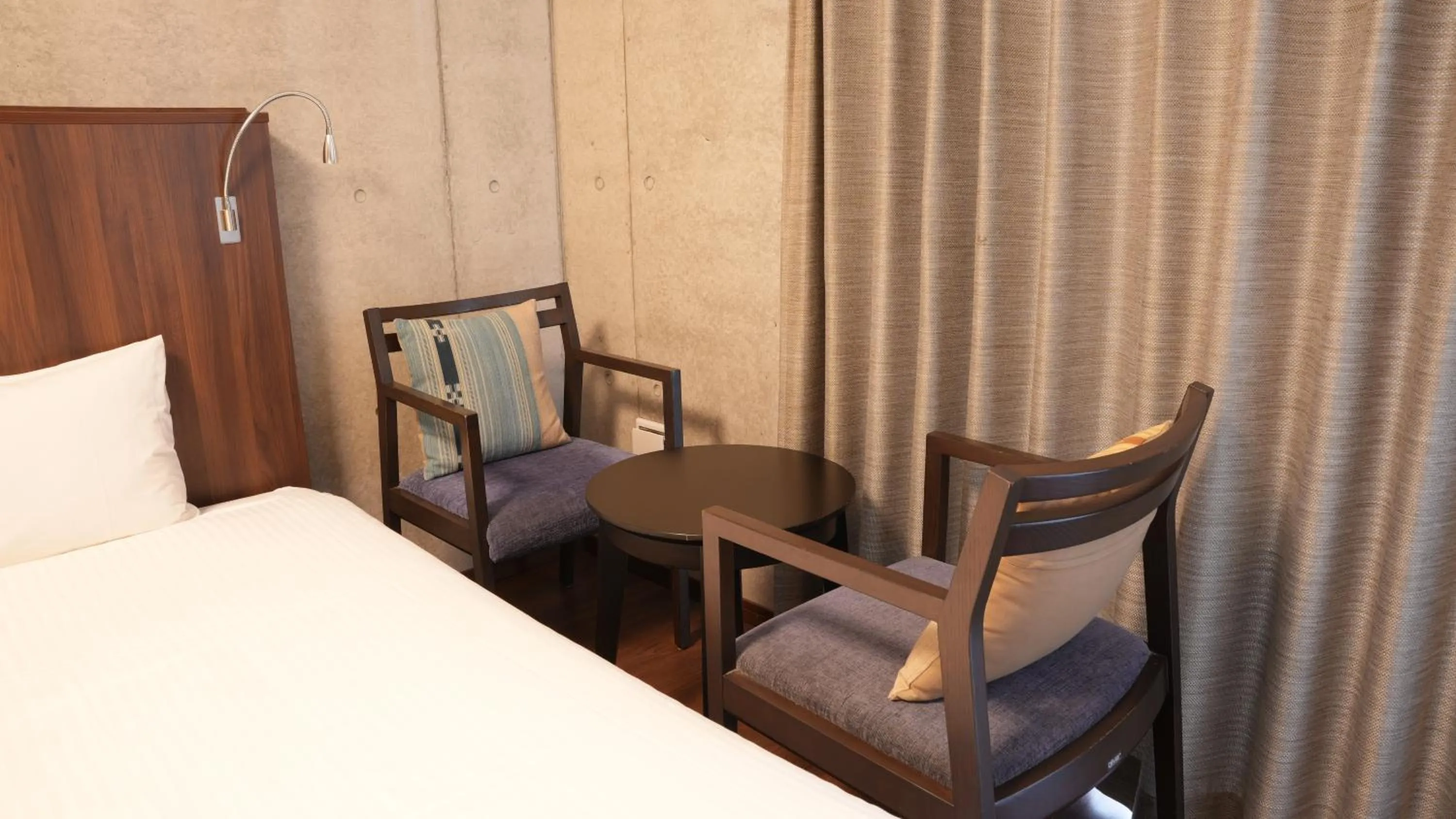 Bed in The BREAKFAST HOTEL PORTO Ishigakijima