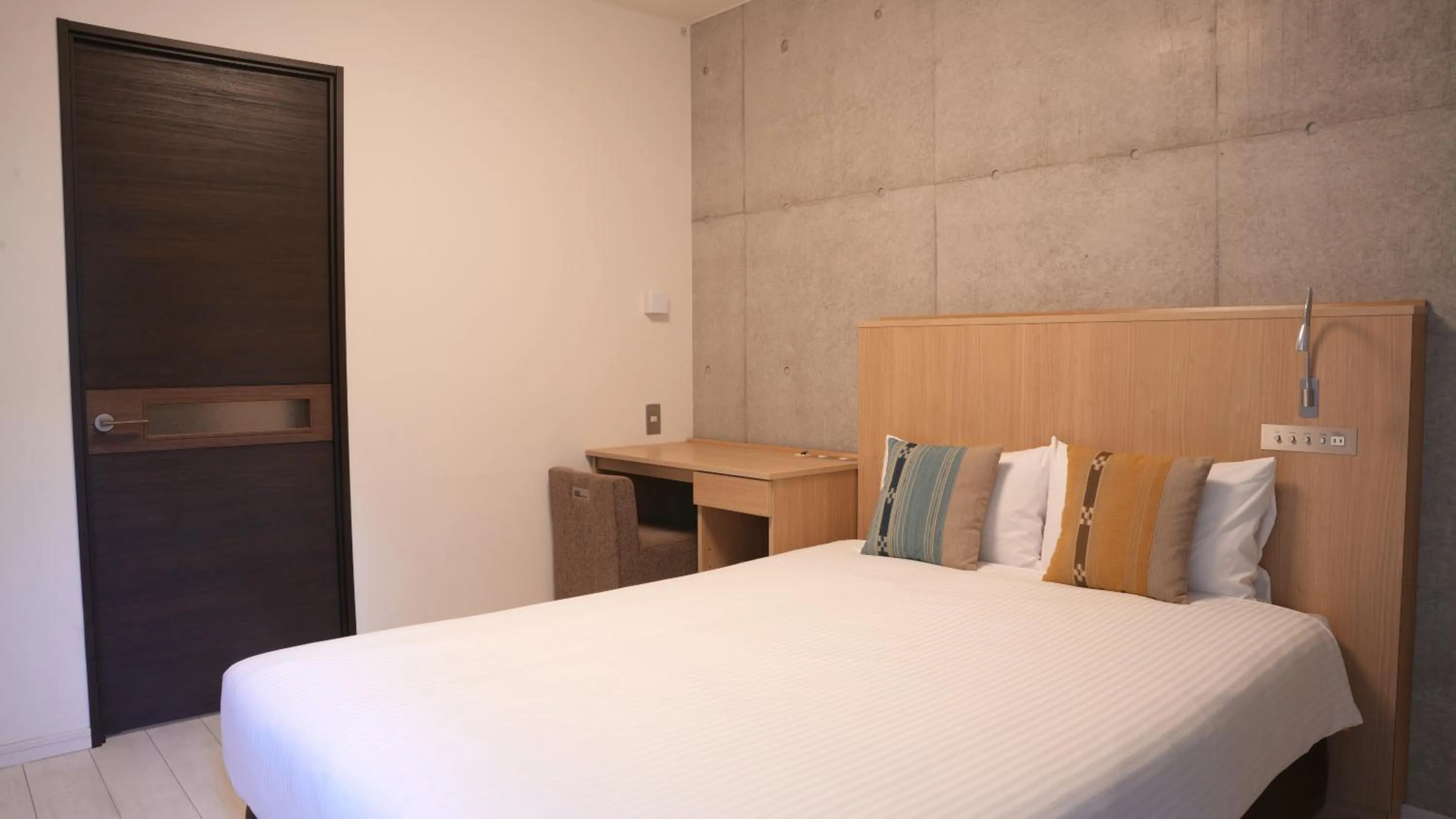 Bed in The BREAKFAST HOTEL PORTO Ishigakijima