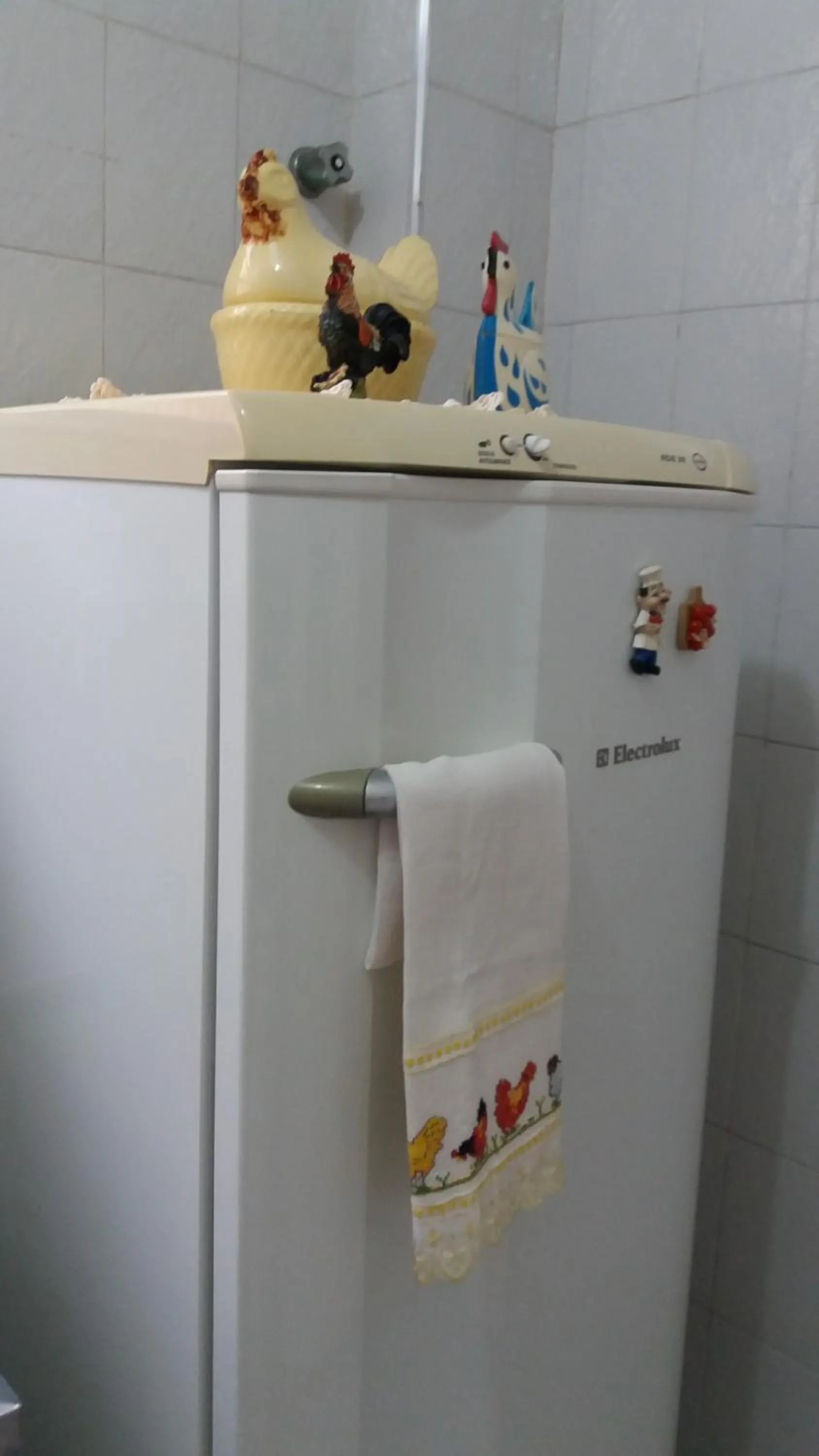 Communal kitchen in Apartamento Aconchego da vovó