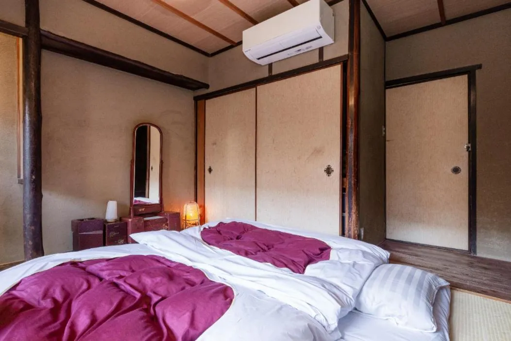 Bed in お宿梅夜Guesthouse Umeya