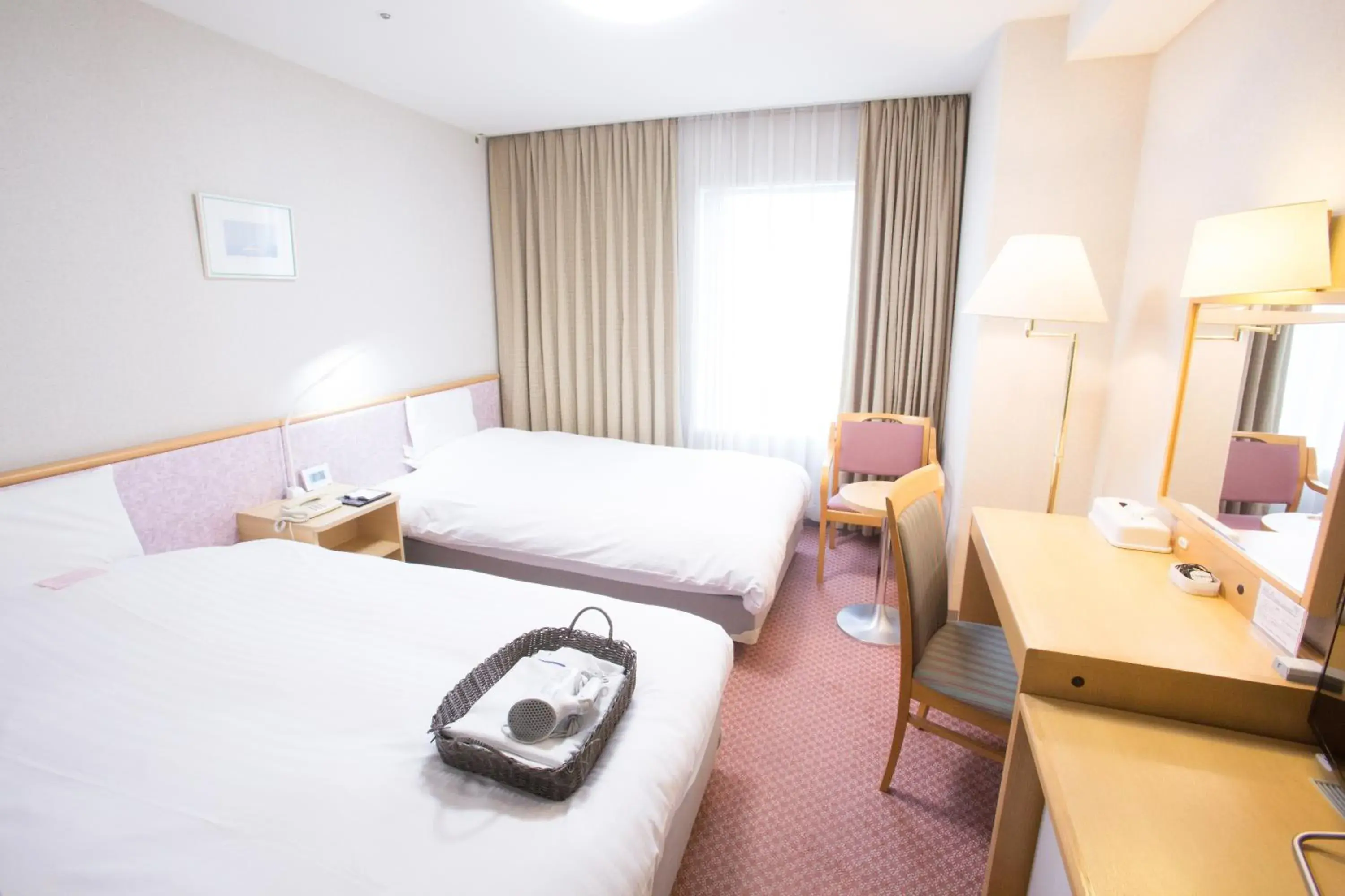 Bed in Toyama Chitetsu Hotel