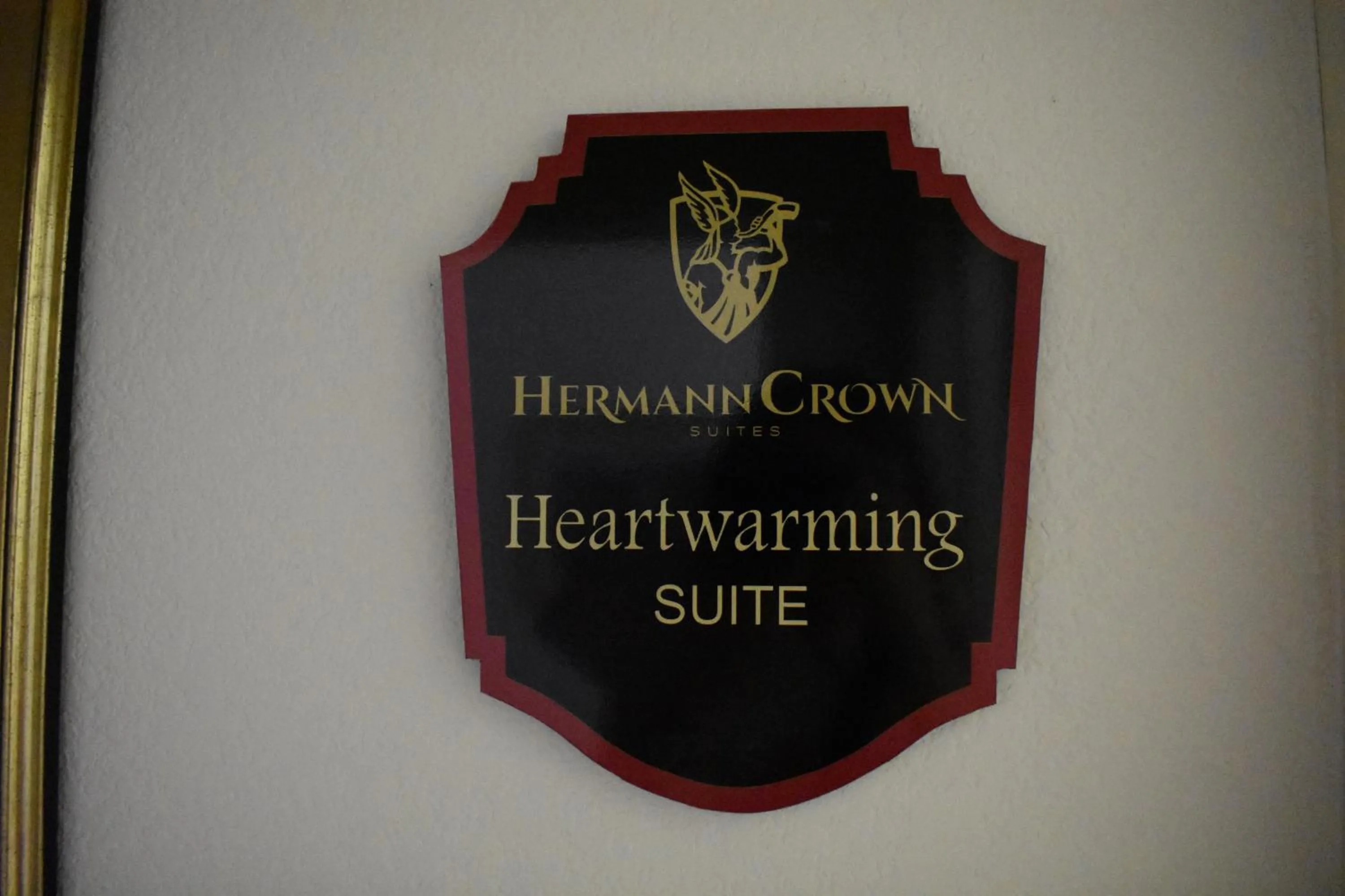 Property logo or sign in Hermann Crown Suites