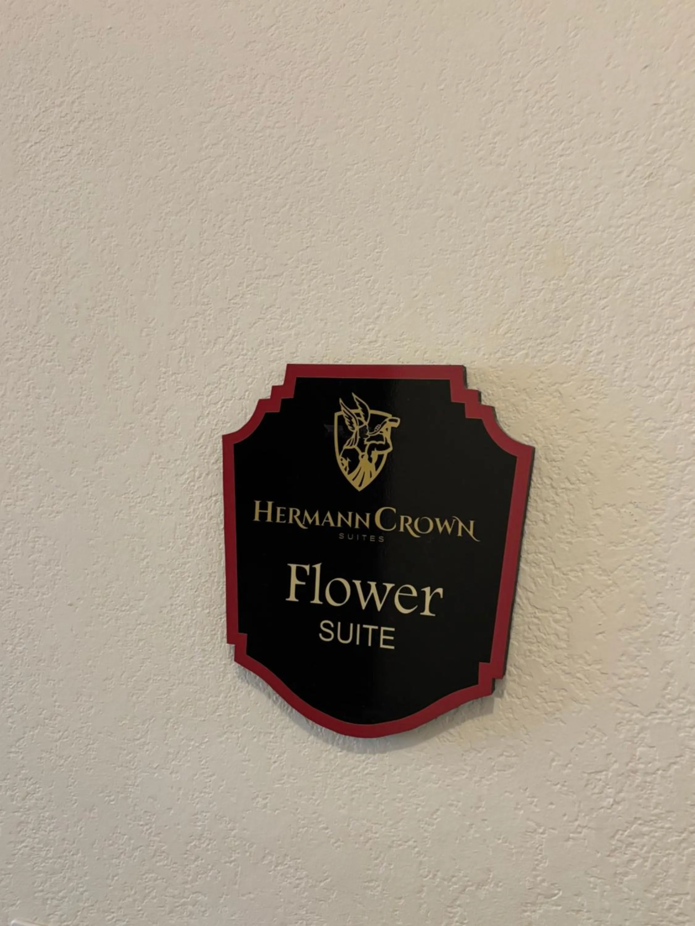 Property logo or sign in Hermann Crown Suites
