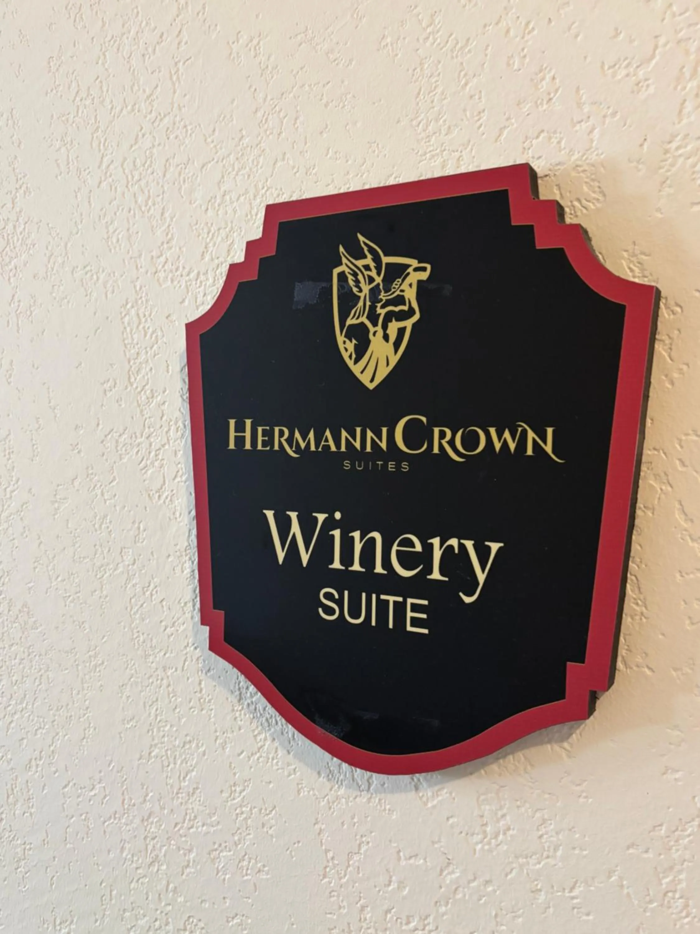 Property logo or sign in Hermann Crown Suites