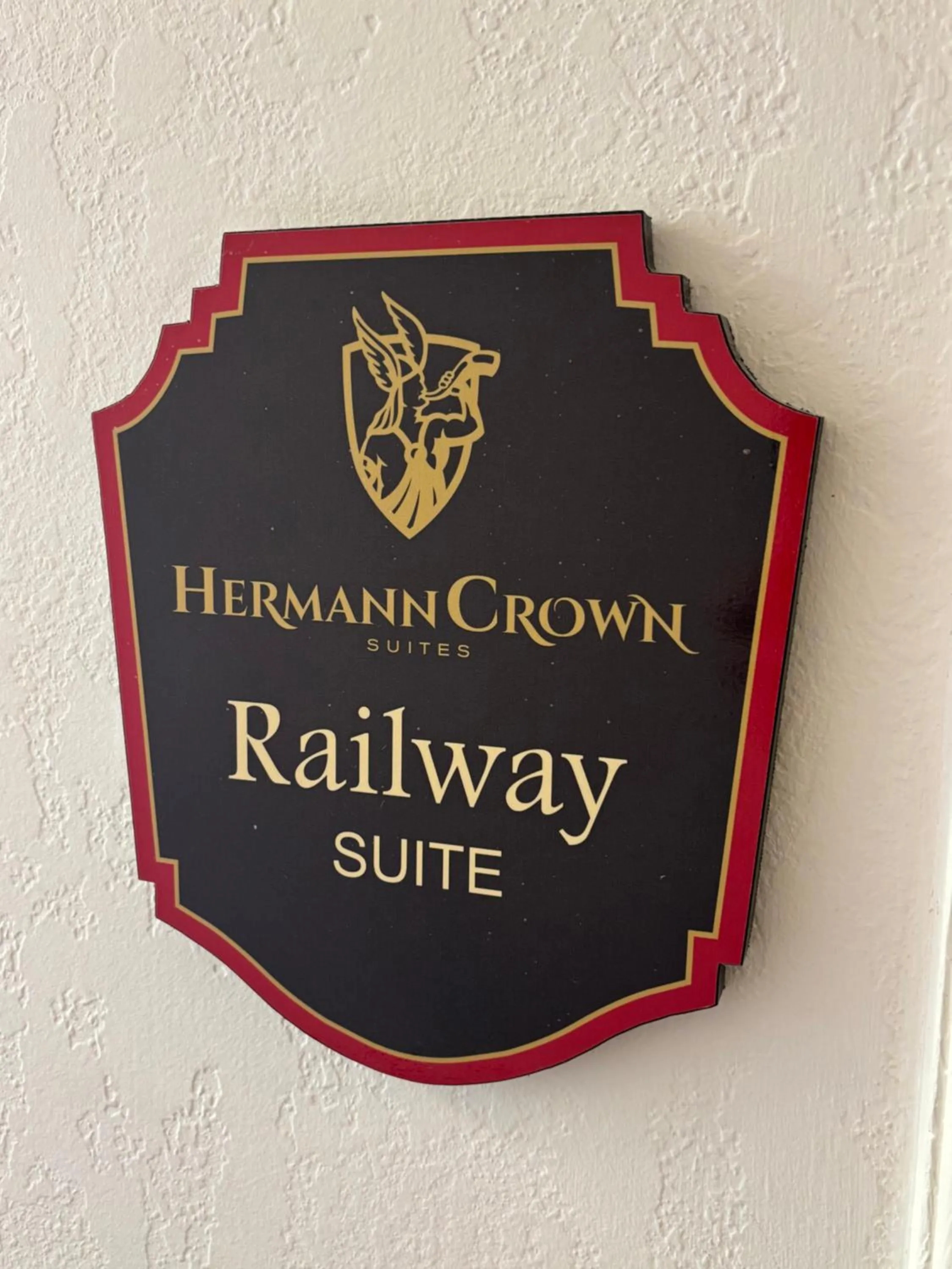 Property logo or sign in Hermann Crown Suites