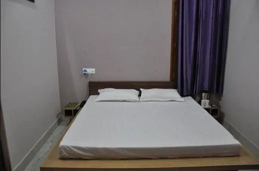 cot, Bed in Vijaya Guest House