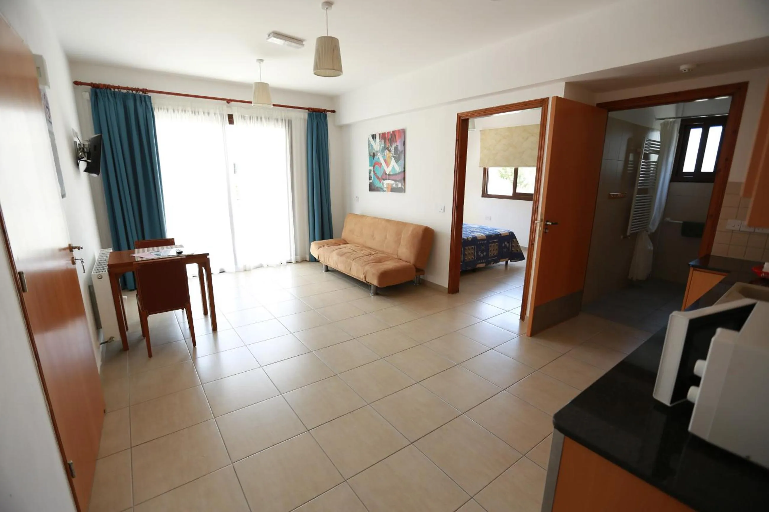 Living room, Bed in C & A Hotel Apartments