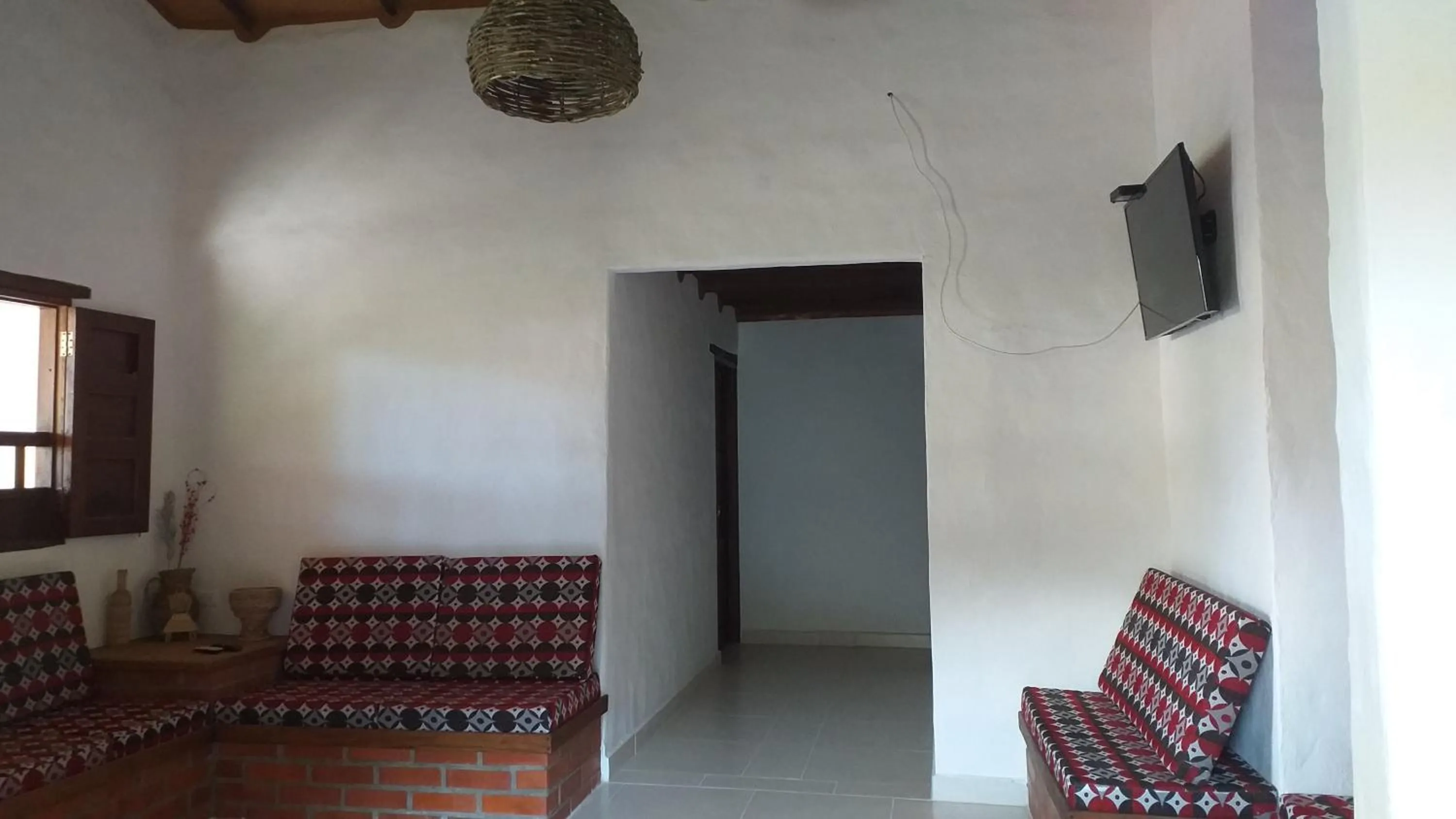 Communal lounge/ TV room in Posada Villa Paula