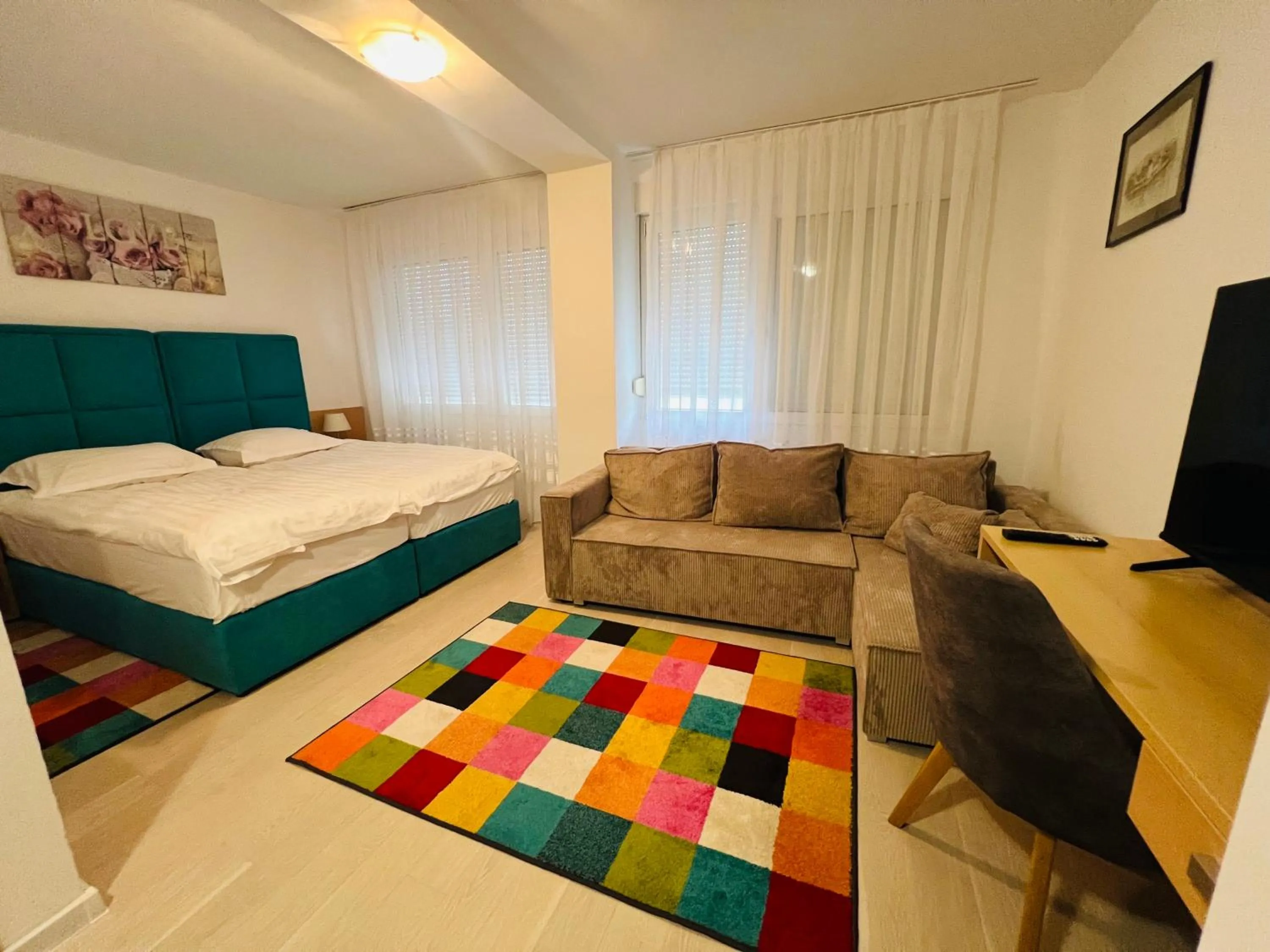 Communal lounge/ TV room, Bed in Hotel Panonija