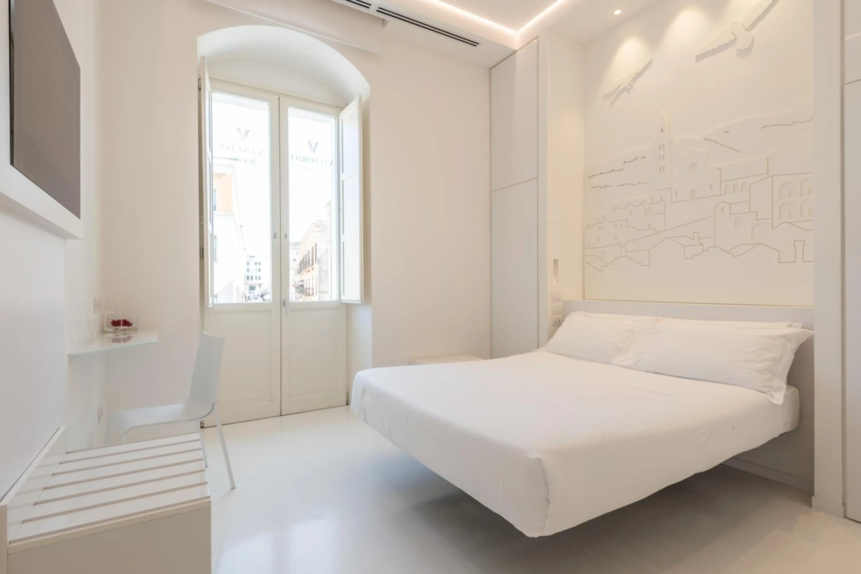 Bed in Vittorio Veneto Matera Luxury Rooms